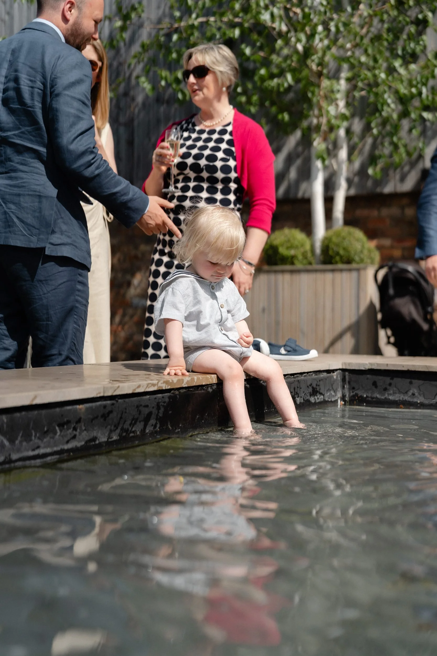 toddler-dipping-toes-water-feature-wedding-380.jpg
