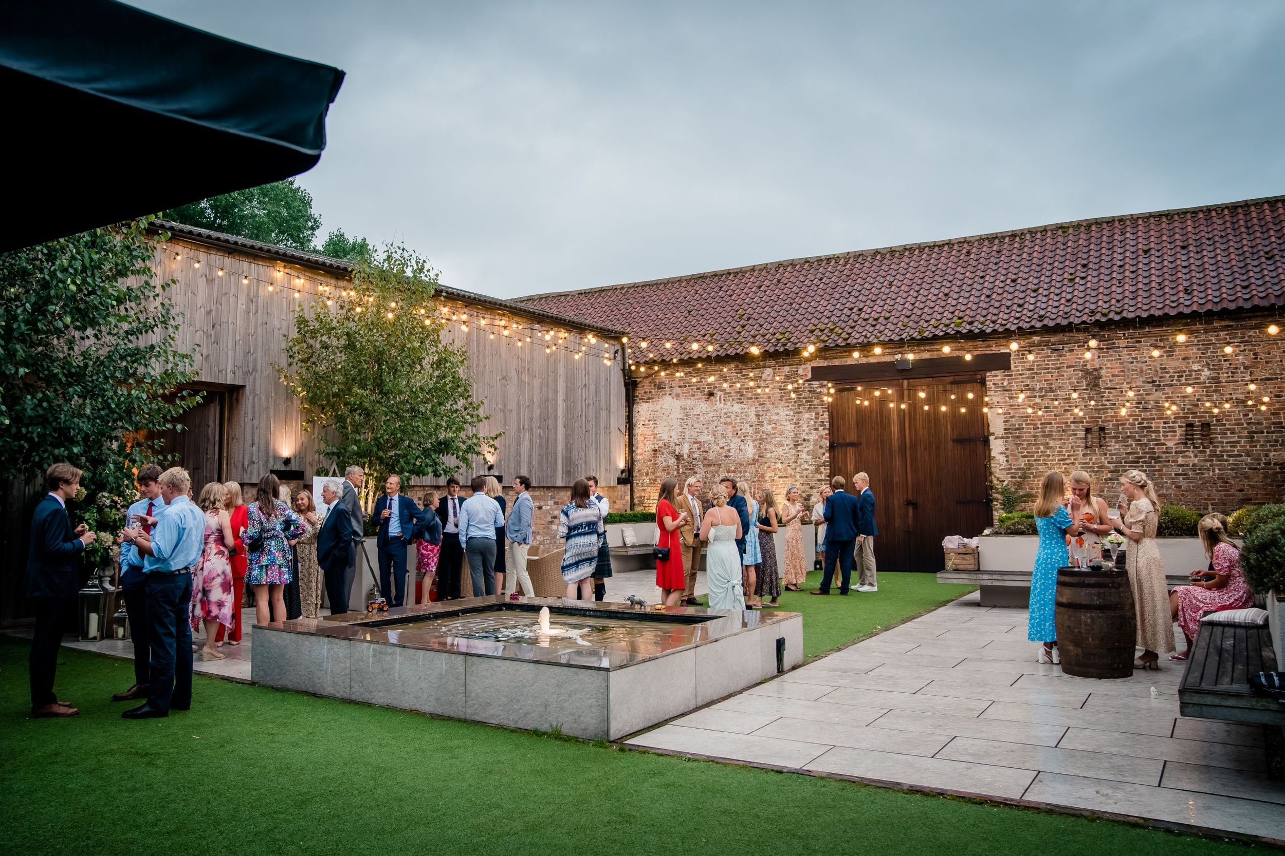 Evening drinks in The Normans wedding venue Courtyard