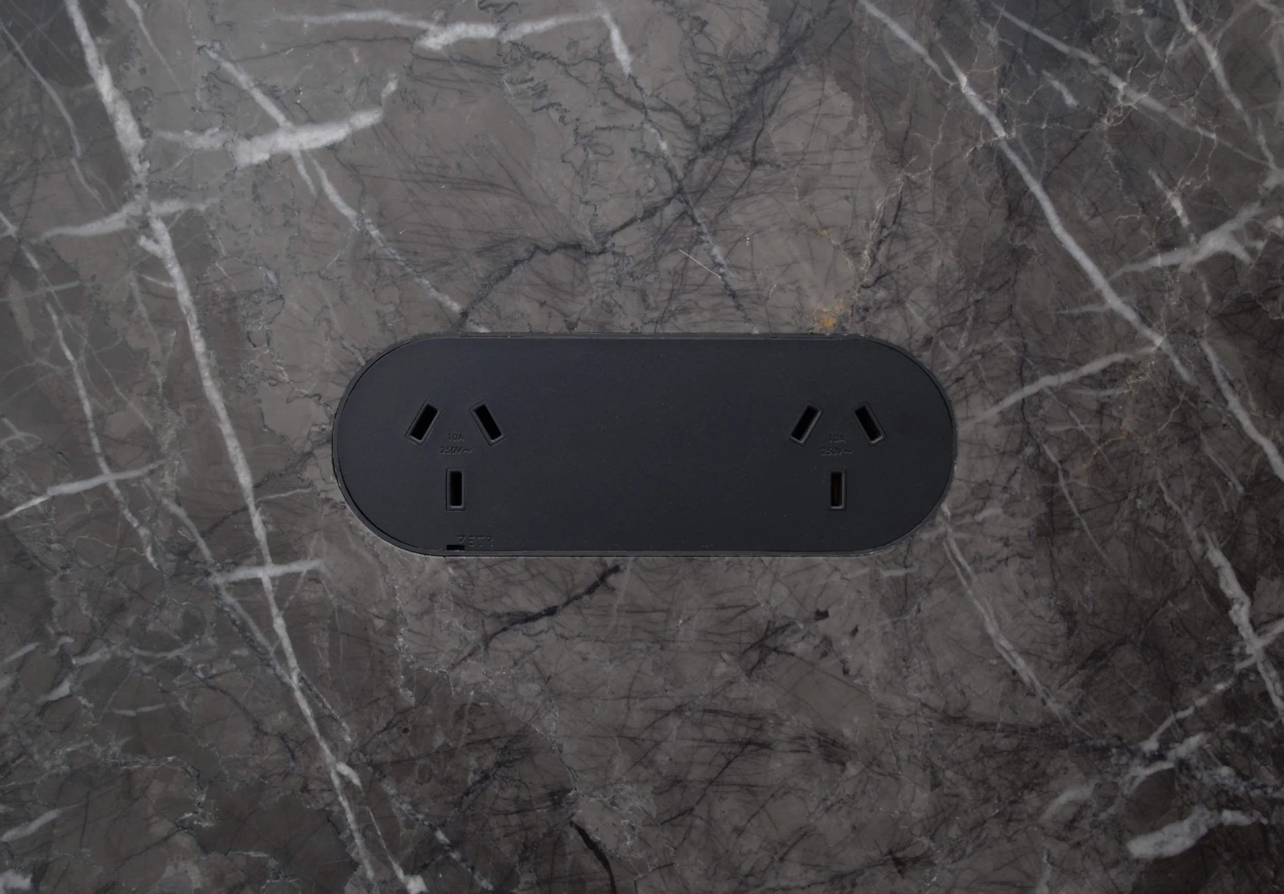 ZETR double outlet in matte black finished flush in marble with our adjustable mounting assembly. 