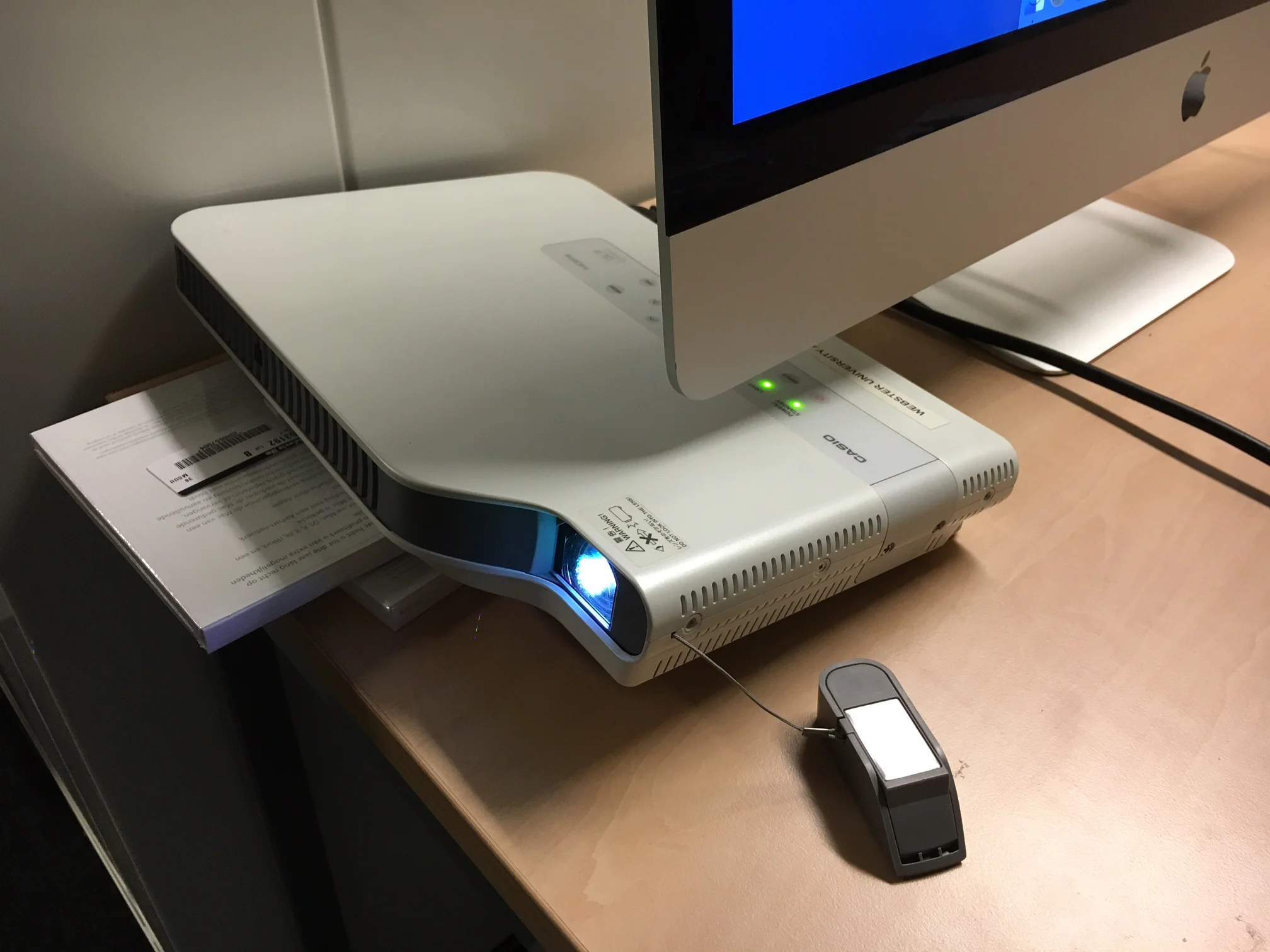 Projector setup: note the technical use of old CD cases to get the angle "just right".