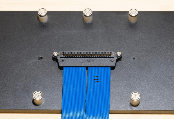 Sample holder being loaded and closed, masks being aligned with backlight illumination and sample holder being sealed with quartz window.