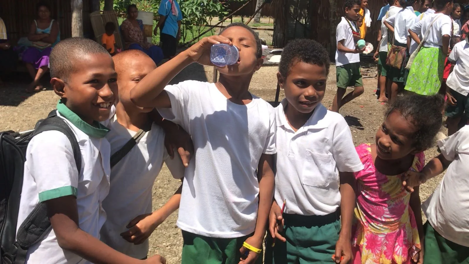 Local school children enjoy drinking from their clean water supply.