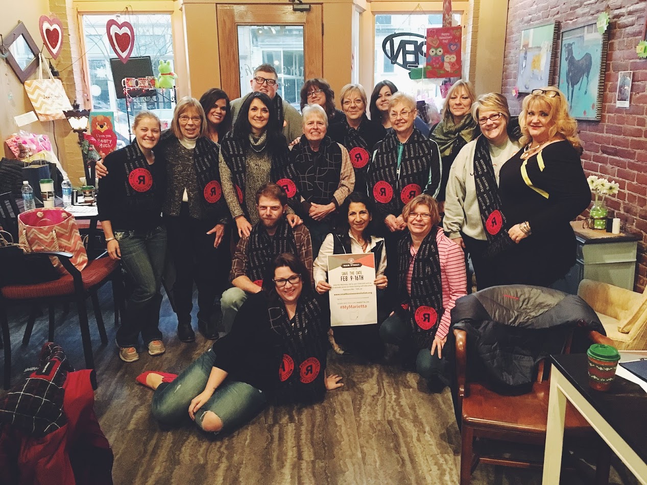 A group of downtown business owners and employees gather with Marietta Main Street to celebrate becoming a Top 8 Small Town in The Small Business Revolution (February 2017)