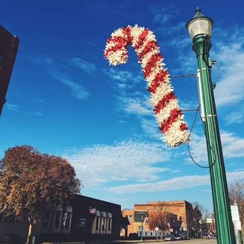 A candy cane from the 2012 Raising Cane campaign hangs on Front Street.