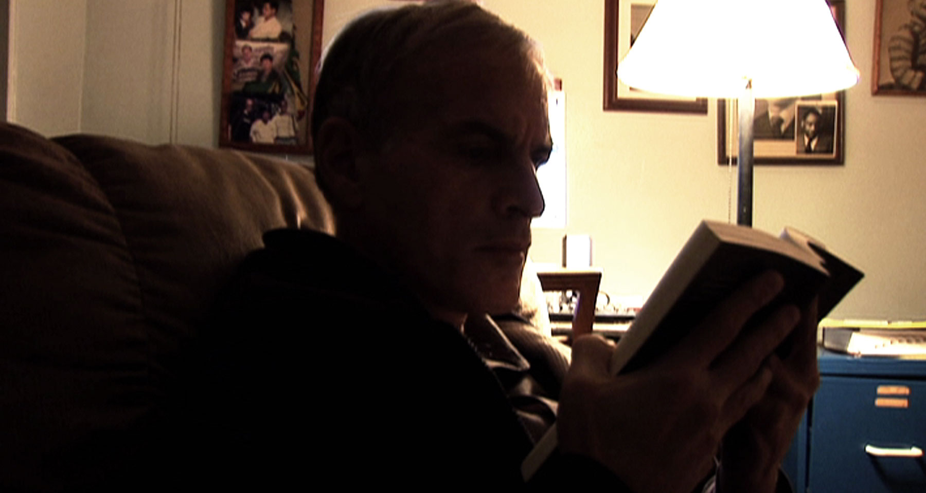 Norman reading at home in Coney Island