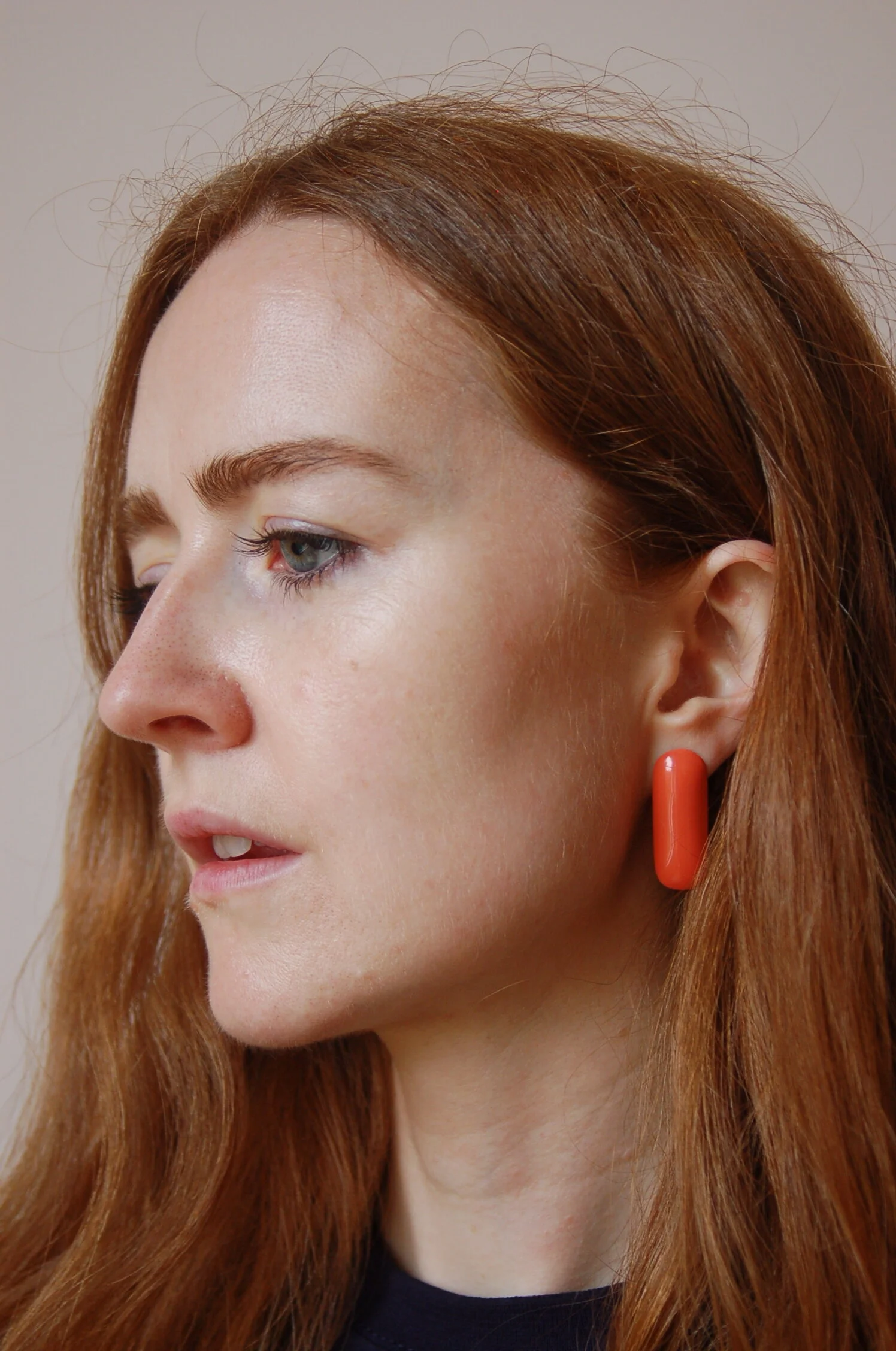 cecilia stamp - pill earrings - teal - model.JPG