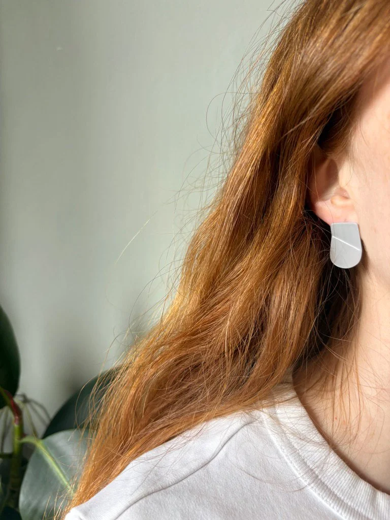 tab-earrings-grey-model.jpg