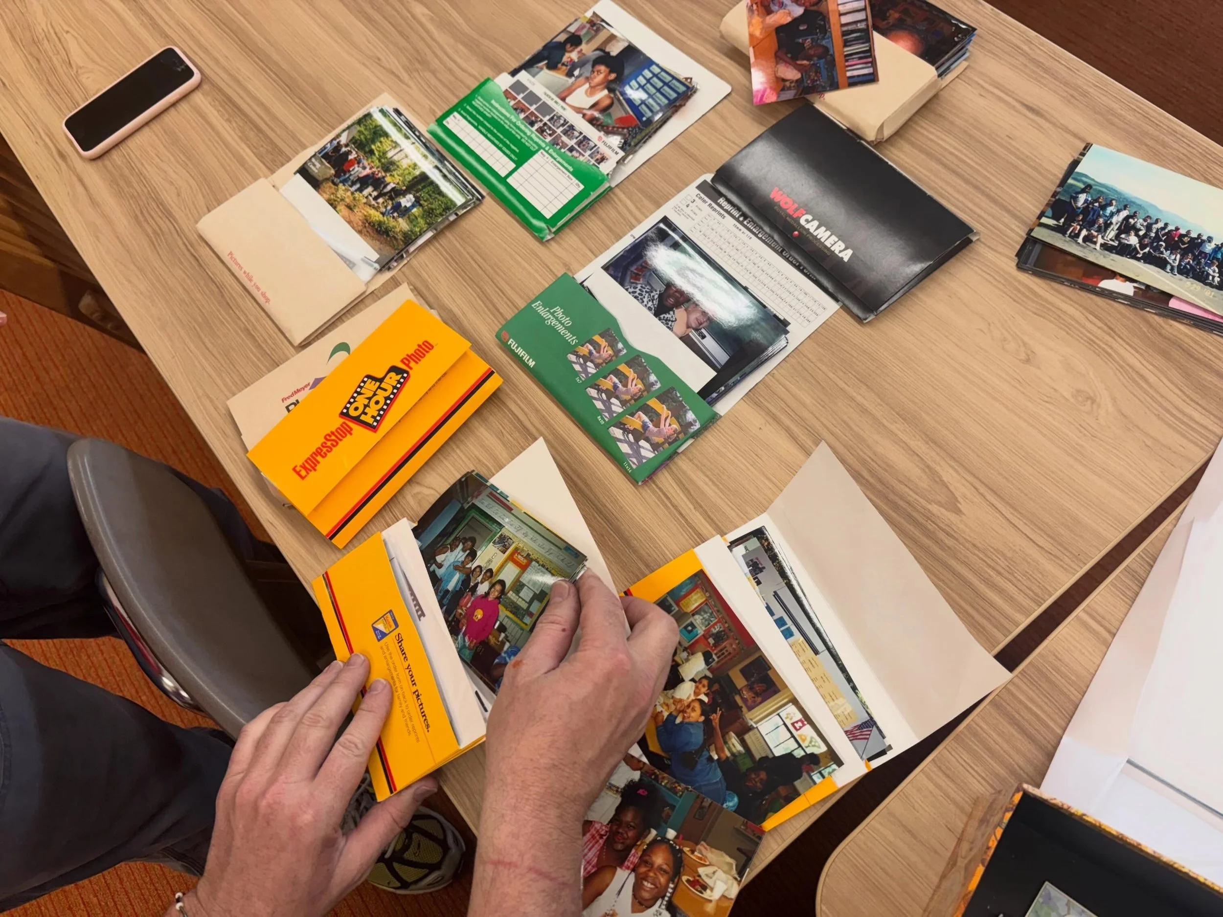 Our interns Matisse and Kelsey are working to update our KSMoCA timeline, which is a part of our permanent collection. Here, they are unboxing stacks of student photos from 2000. Recognize anyone?