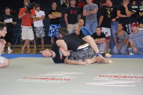 Author (top position) during first match of his first Brazilian Jiu-Jitsu tournament. This was just after he swept his opponent for two points to secure the win. Birmingham, AL circa 2006.