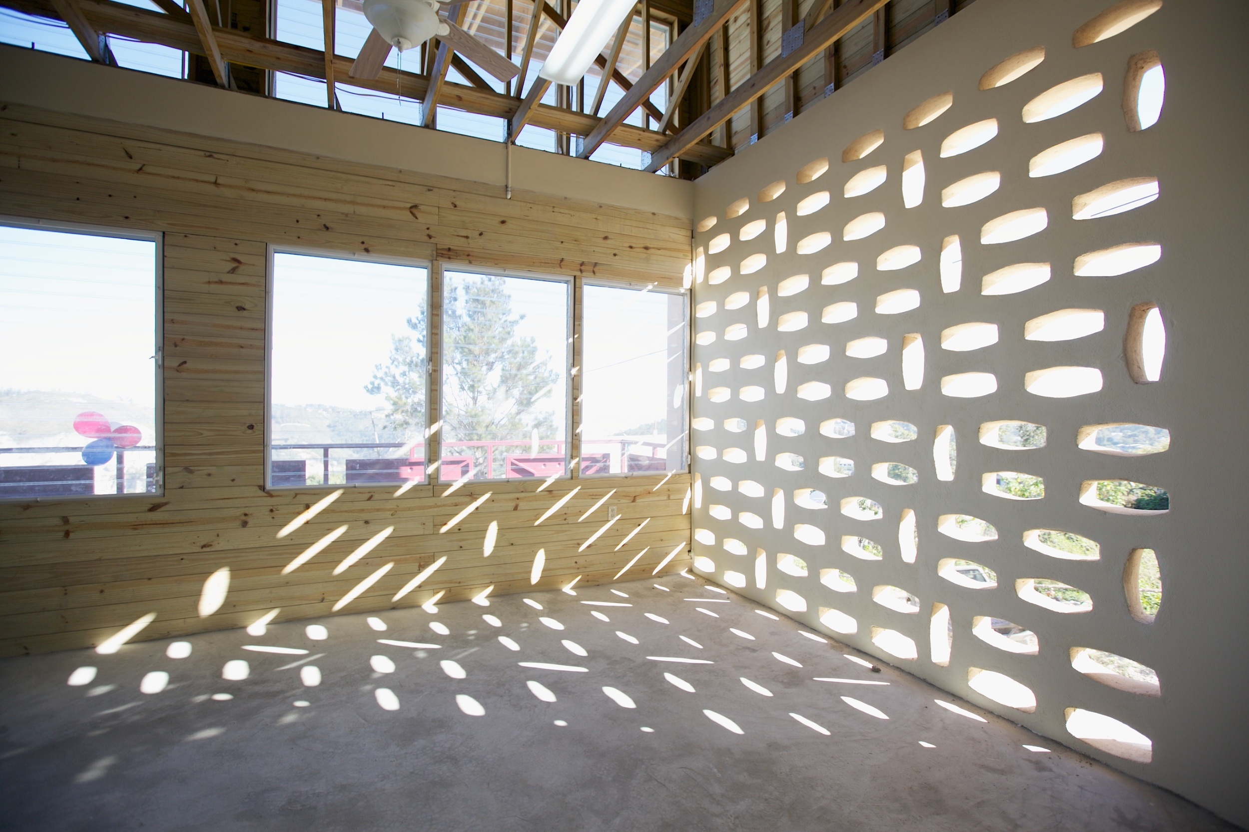 Locally-cast masonry units provide dappled sunlight to the institute's interior spaces.