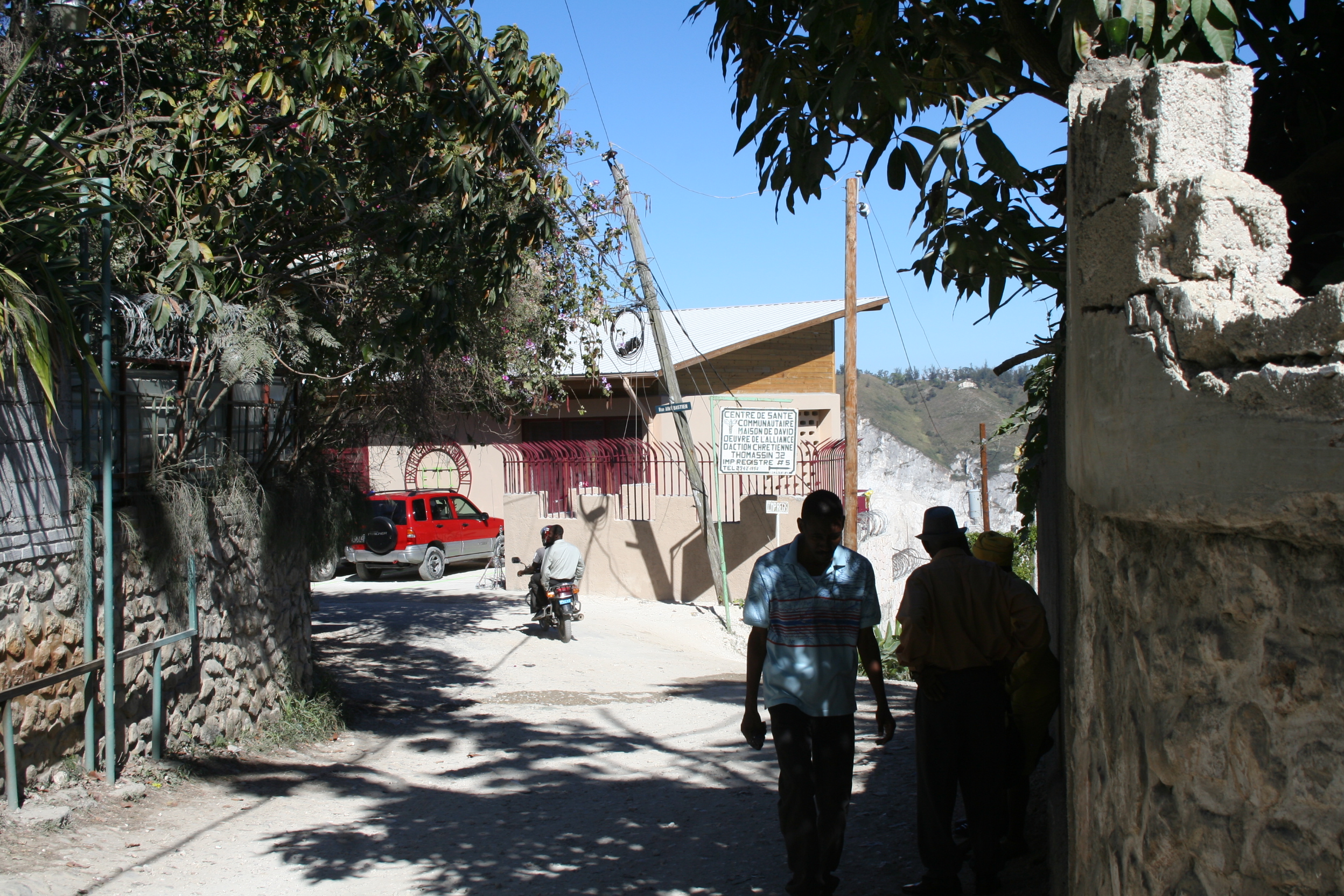 The facility is situated on a ridgetop above Port-au-Prince and accessed through narrow winding lanes.
