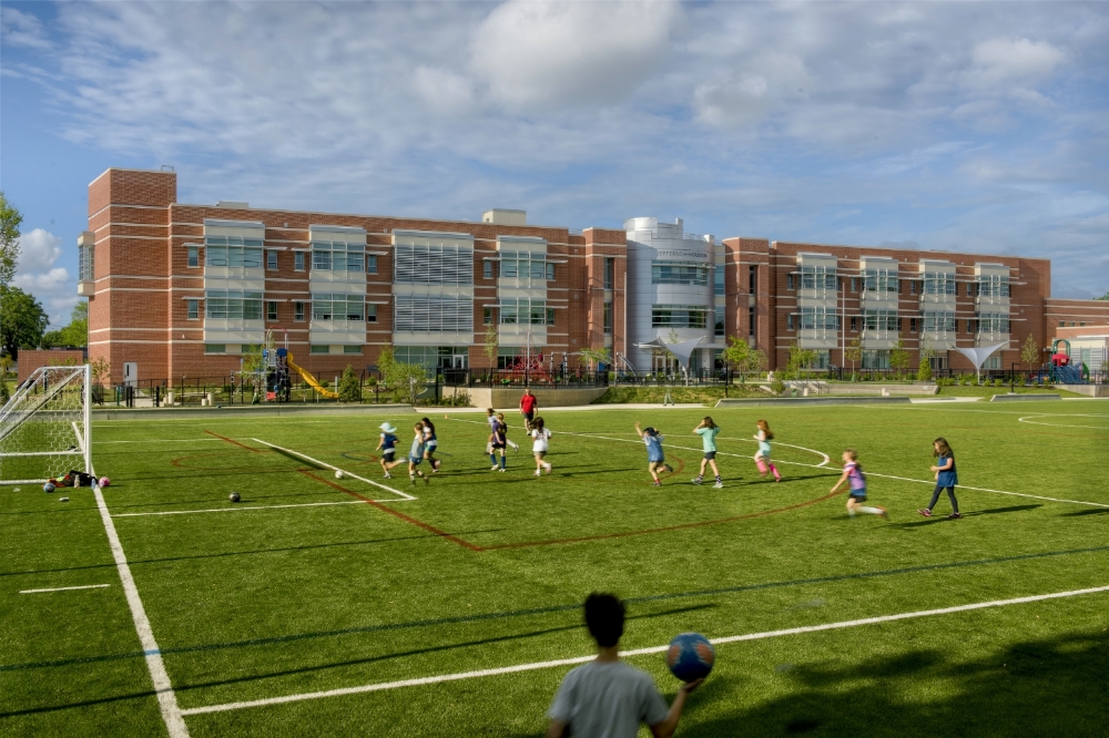 An artificial turf field invites active play and invites joint use by local community groups. 