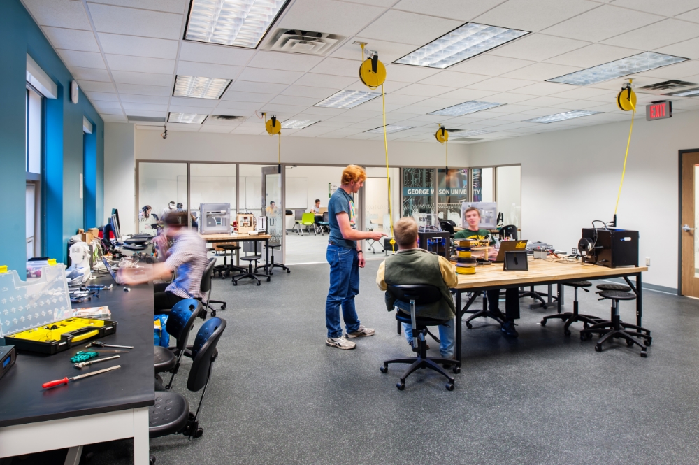 Overhead power reels in the new student-run Maker Space support reconfiguration of the space and help maintain a safe and tidy work environment.