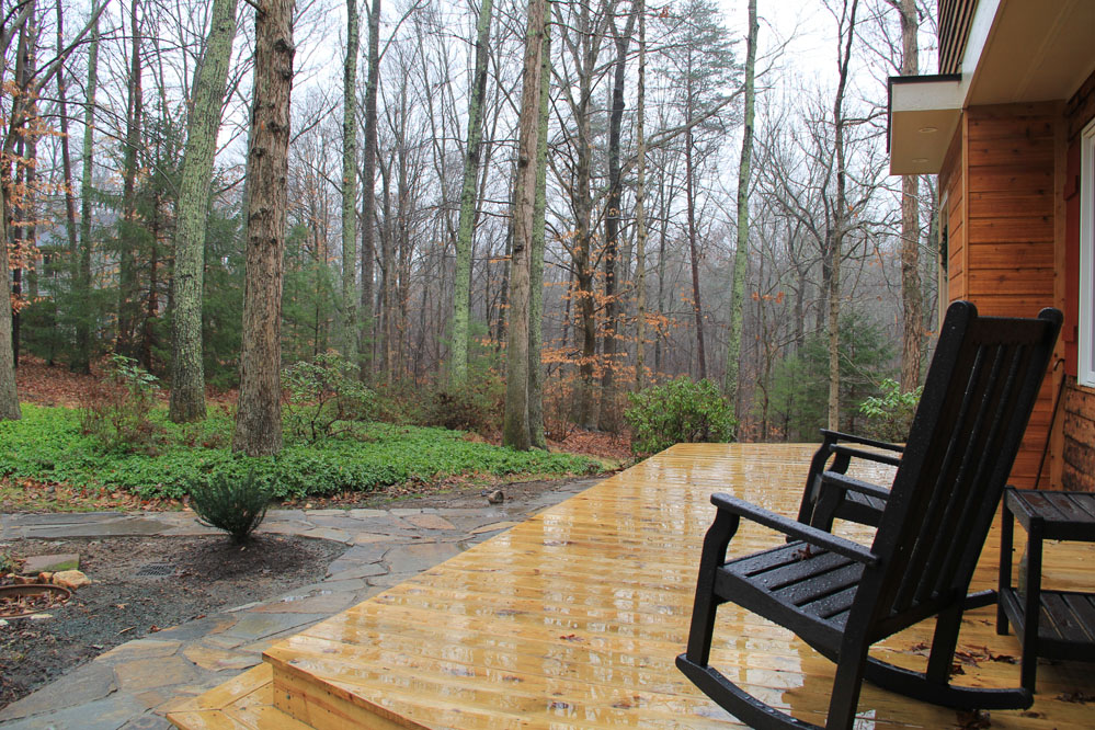A new front porch provides an idyllic place to enjoy sunrise in the forest. 