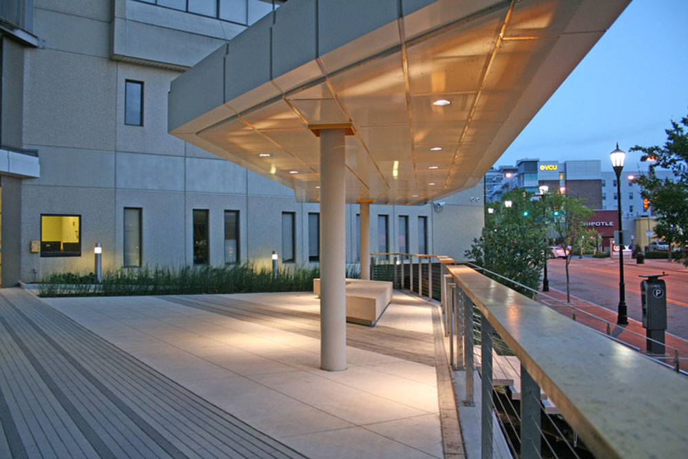 The internally-lit plaza canopy provides shelter and shade for residents. 