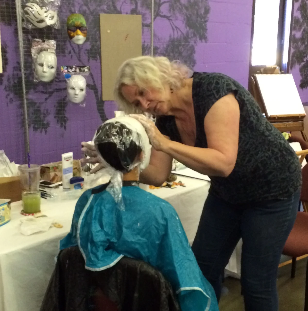 Carol Faber-Peake making a mask