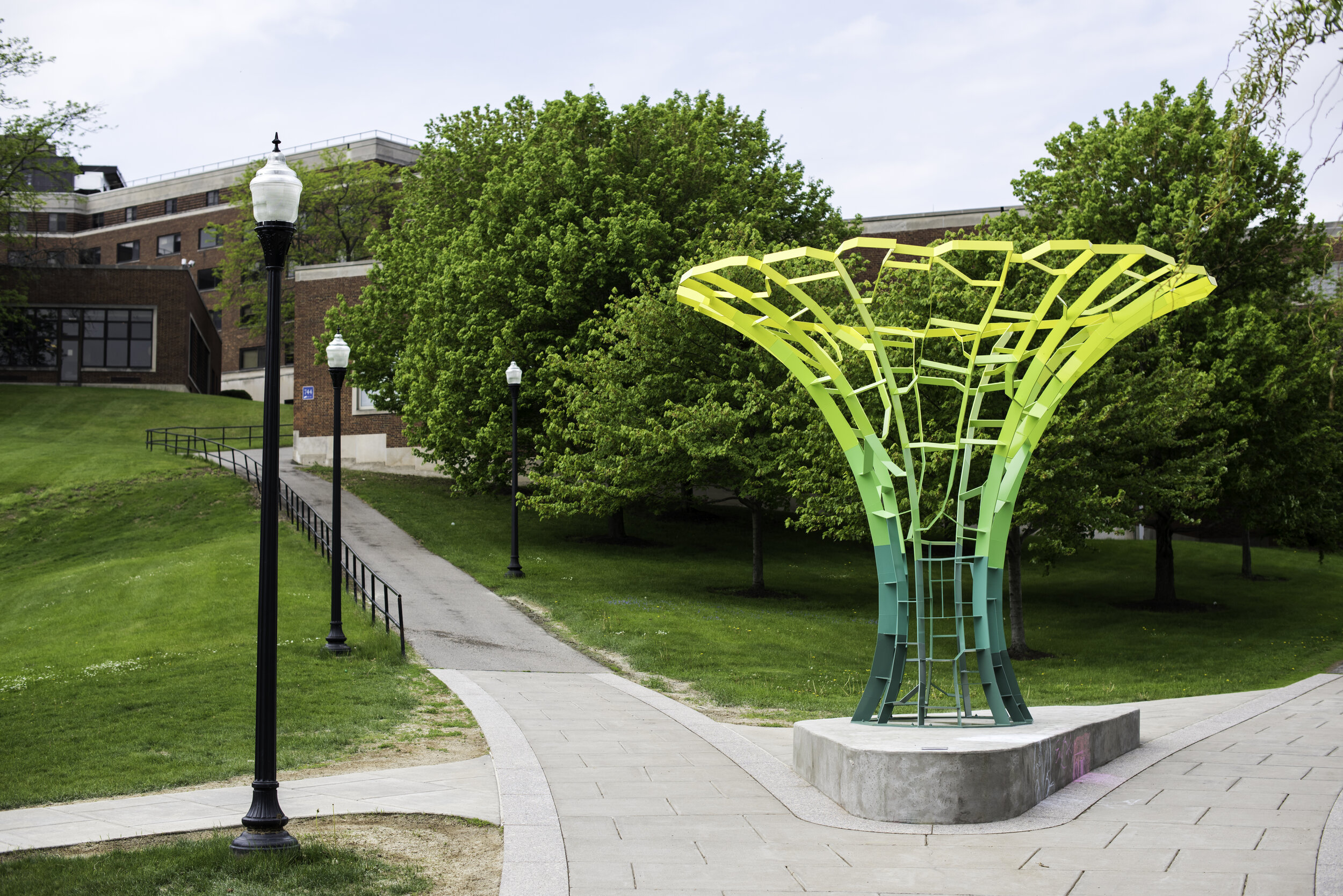  Calyx, a recently-installed, computer-generated welded steel sculpture designed by Turkish artist Sabri Gokmen, that celebrates technology, nature and knowledge, is pictured outside University of Rochester's Sage Art Center May 18, 2015.  // photo b