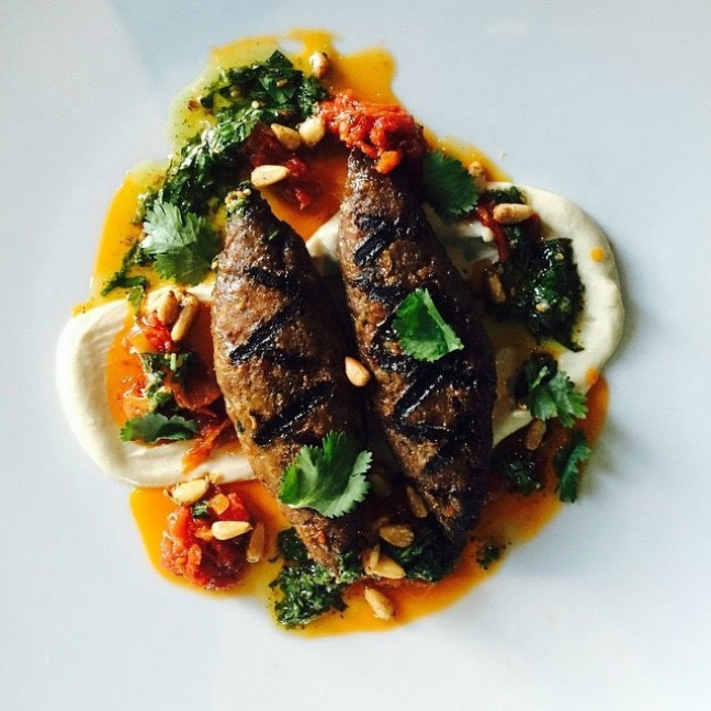 Lamb Kebabs over tahini, tomatoes and cilantro