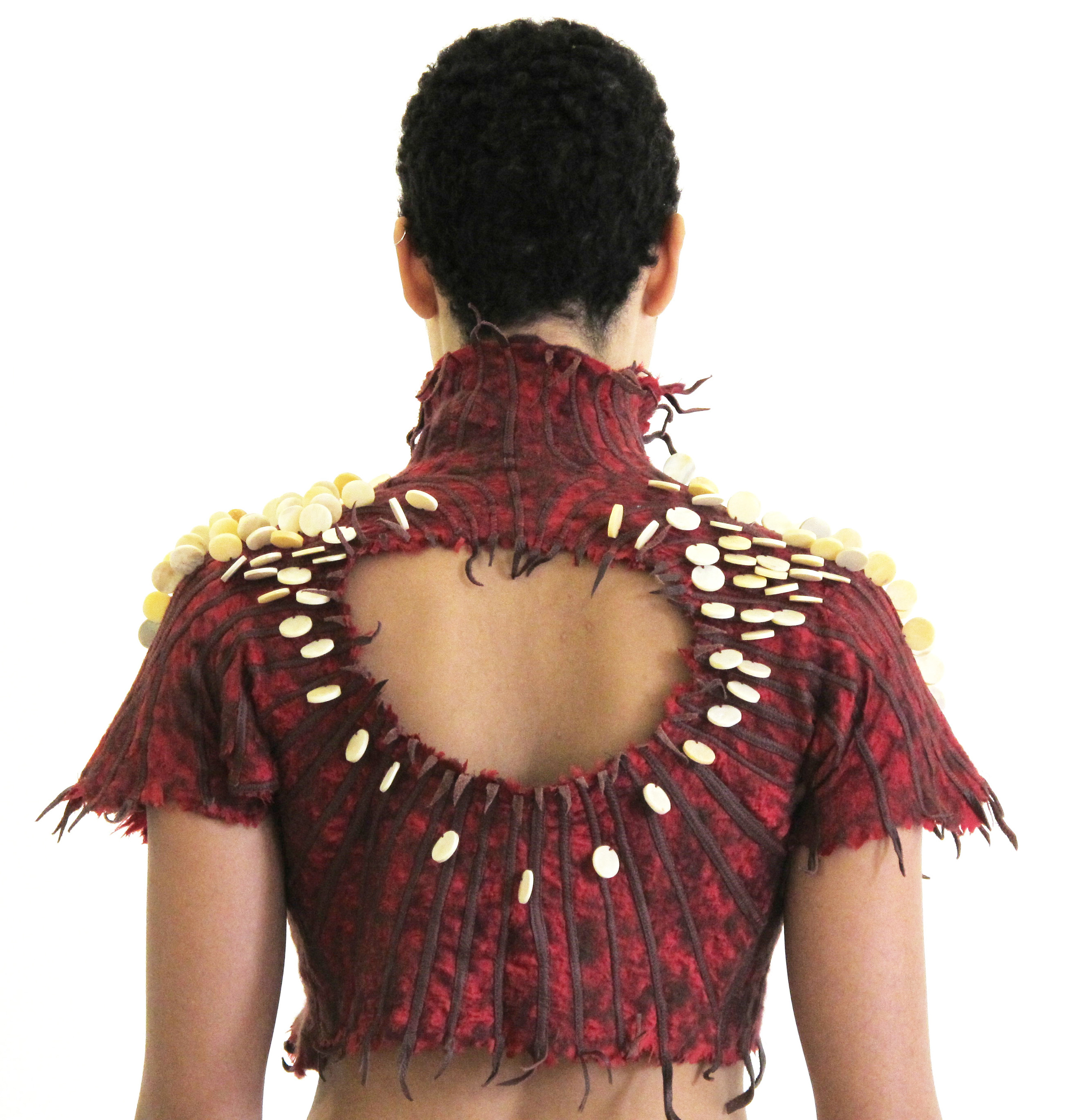 Silk garment with needle-felted wool, leather strips, and bone beads.