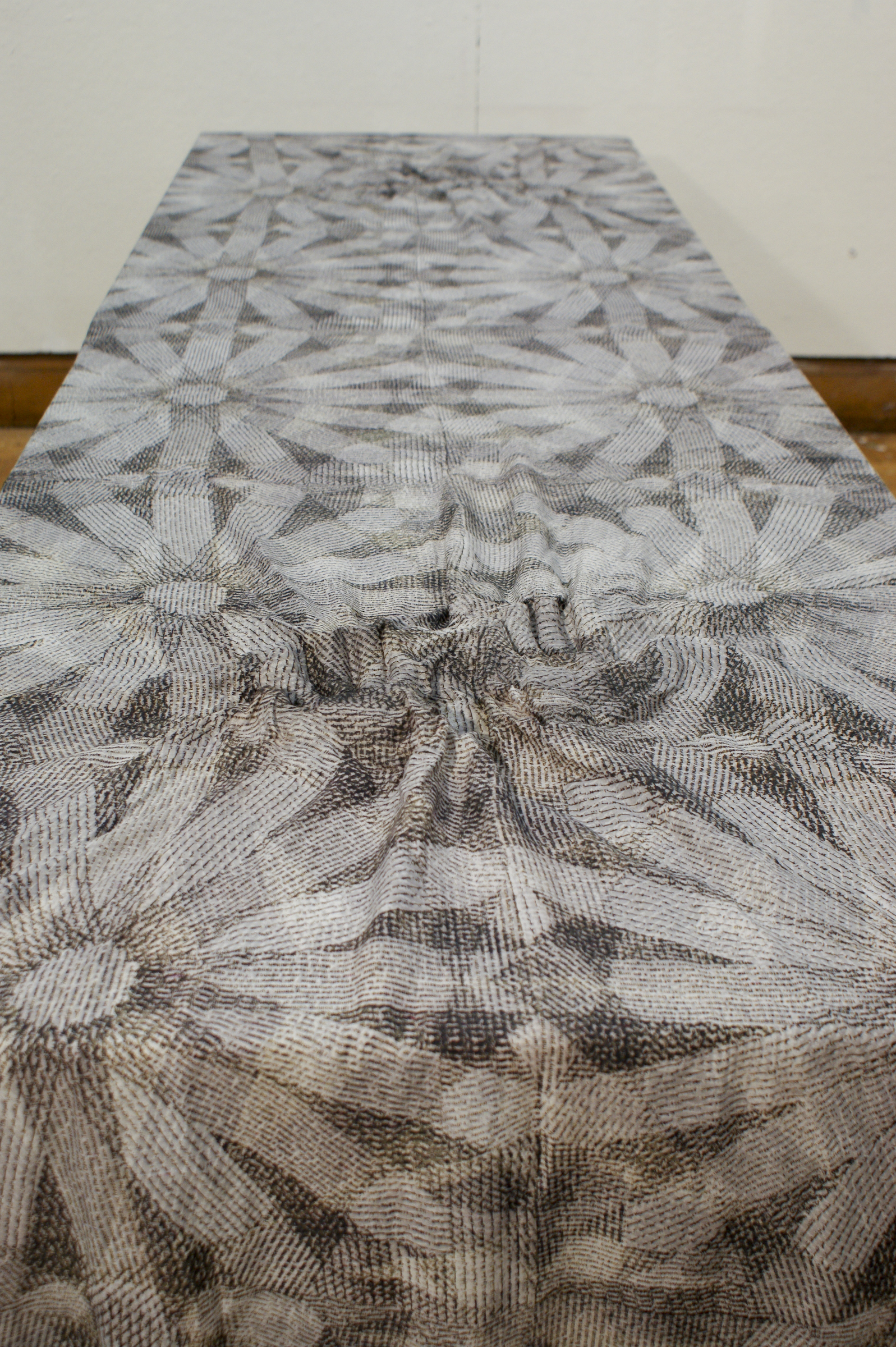 Al Akhbar print. Newsprint in Arabic, French, and English screen-printed with dye on cotton. Starched handprint. 