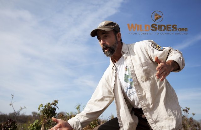 Photo 6: Chris Joking Around in the Field. This is a high resolution photo by Jeffrey Mittelstadt and is not a screenshot from the film. We will remove the WildSides.org watermark. 