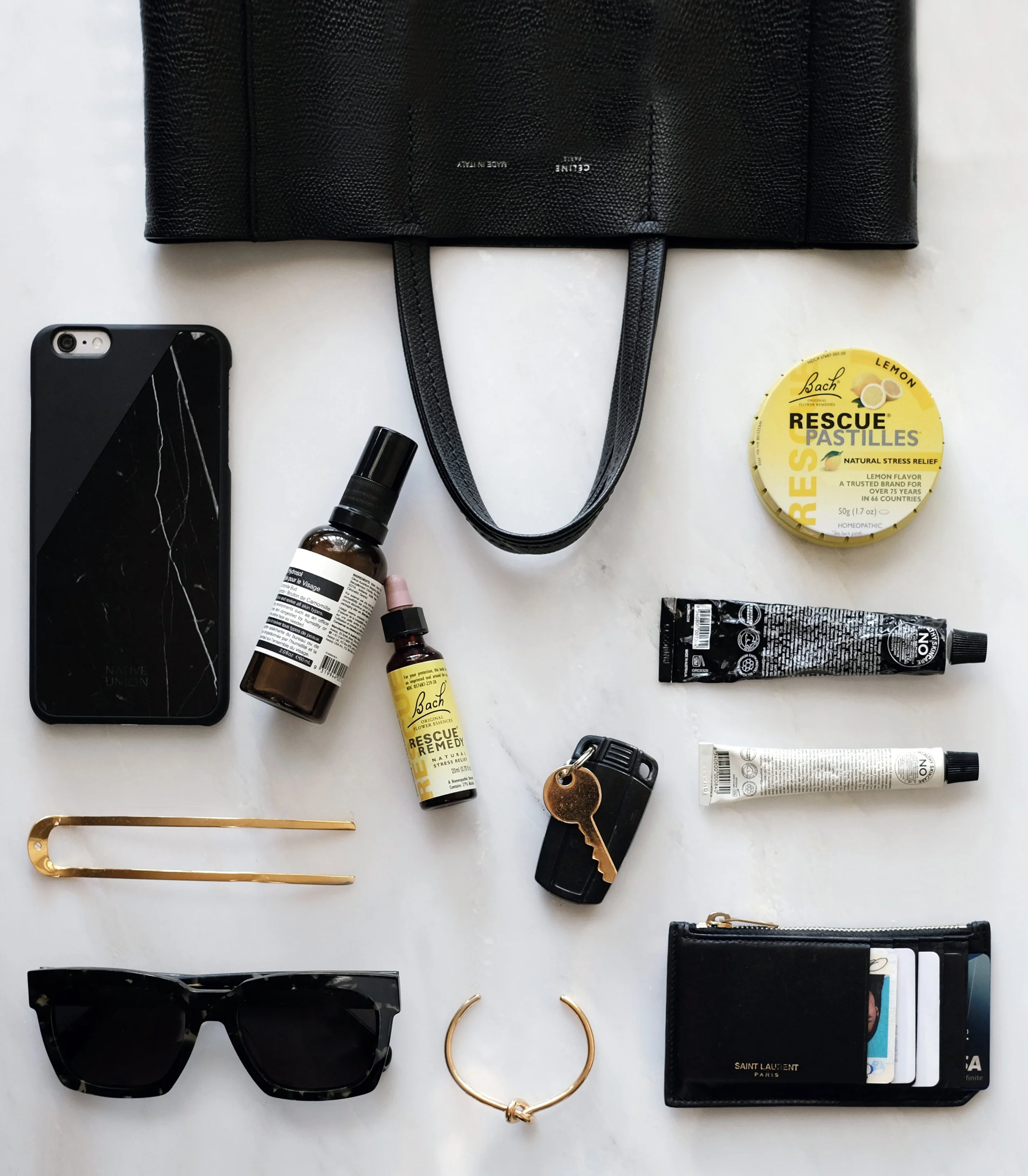 CÉLINE Bag and Cuff / BACH Rescue Remedy Drops / SYLVAIN LE HEN Hair Pin 014 / AESOP Facial Hydrosol / GROWN ALCHEMIST Hand Cream and Face Cream / GENTLE MONSTER Sunglasses / BACH Rescue Pastilles / SAINT LAURENT Wallet