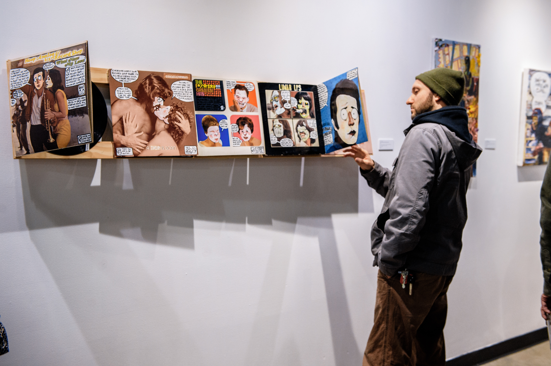 These record covers were painted and converted into a comic about opening a vinyl shop and the imagery was AMAZING.
