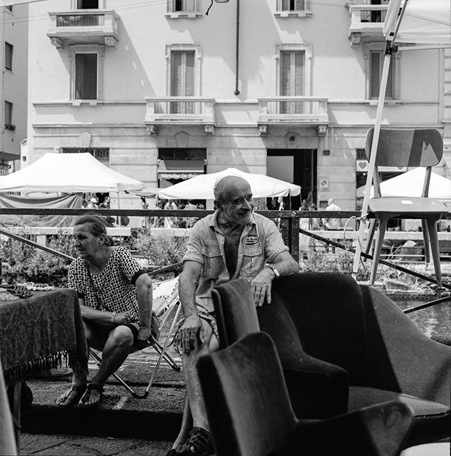 People of #Navigli. There are smiles for happiness and smiles for being thankful for this amazing life. #streetphotography captured with #hasselblad500cm with a stunning #planar80mm with a film-roll of #120mm #kodak #kodaktrix400. #developed in my #d