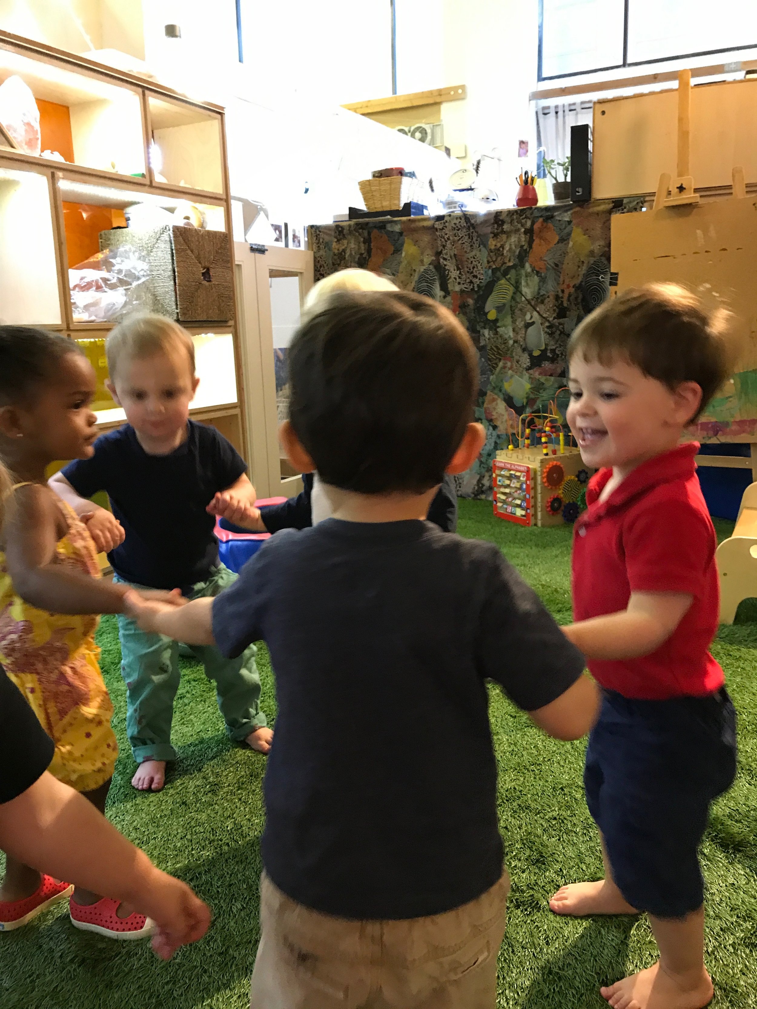  Playing Ring Around the Rosie in the gym! There's lots of gross motor coordination in this game - to play you've gotta be able to  walk sideways in a circle  , which may sounds kind of silly, because as adults...we've been able to do this for years.