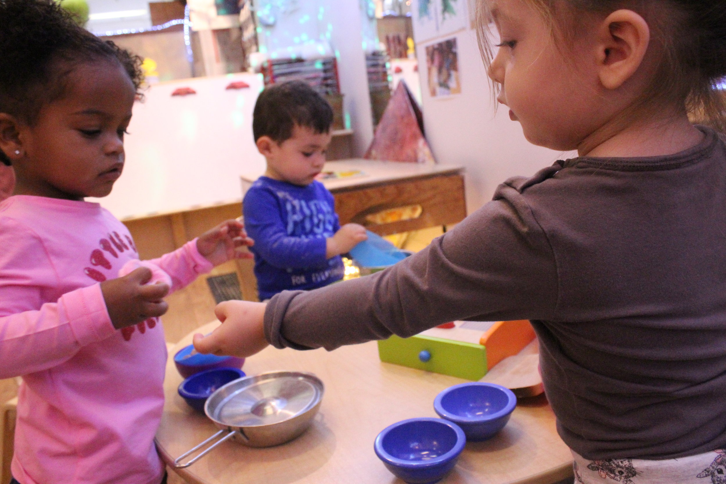  Nina and Katerina making "breakfast" for their babies. 