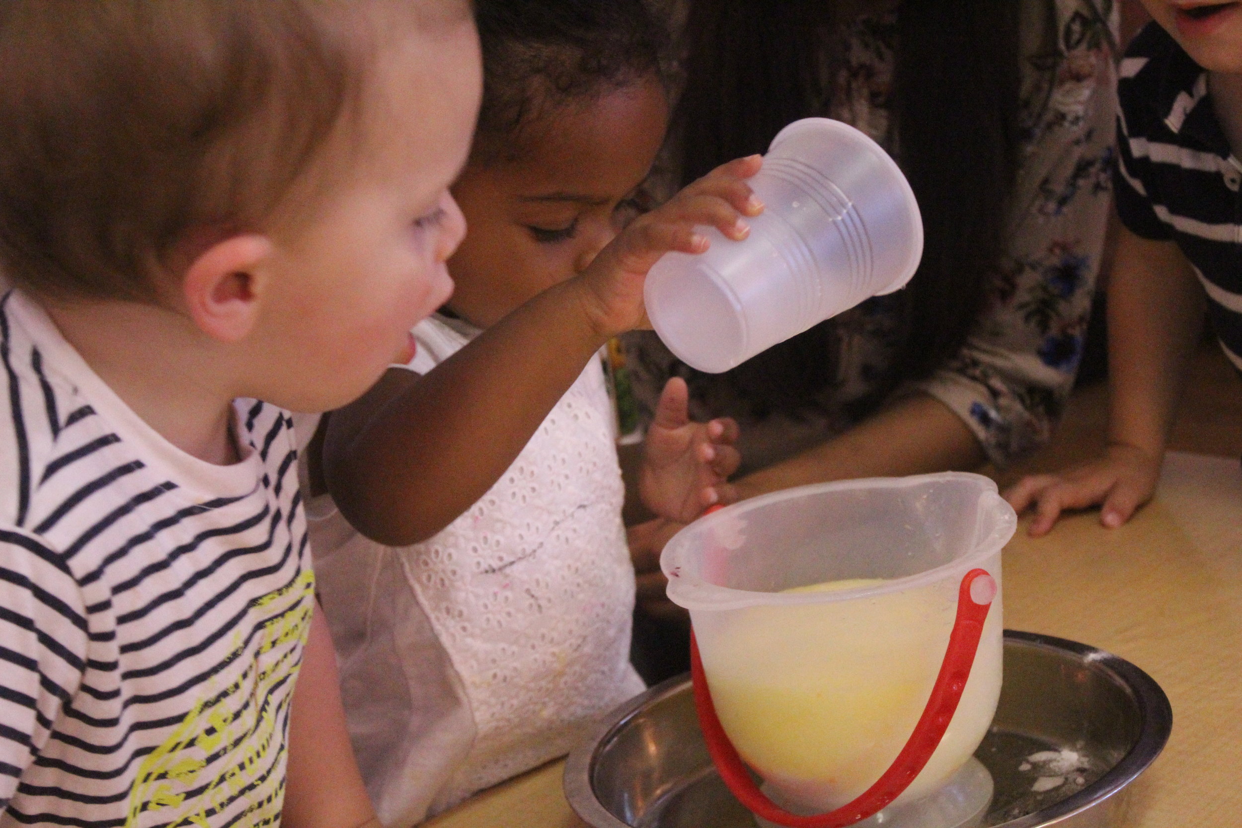  This week we experimented with vinegar, baking soda, and food coloring.&nbsp;  Quotes from the children included:  "Wow!"  "Bubbles!"  "One more time!"  "More!"  "My turn!" 