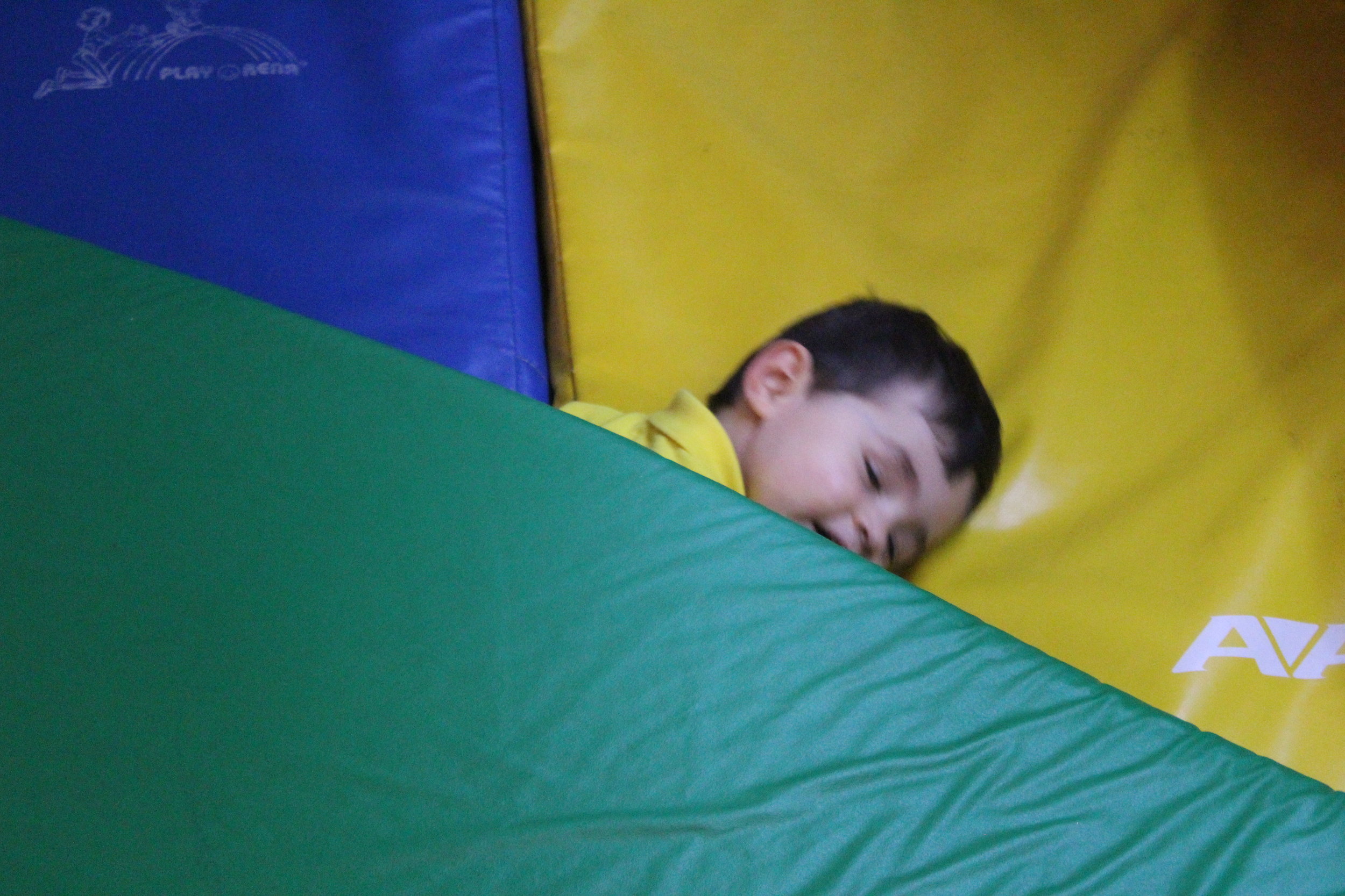  "Night, night!" - Emilio  Emilio demonstrating a key toddler play skill - imitating others by pretending to sleep - all the while doing it with a smile and humor!&nbsp; 