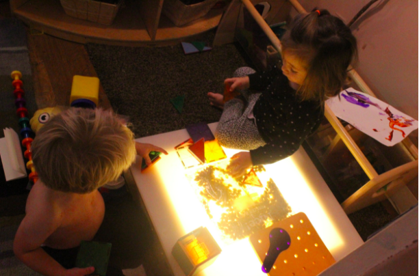  We've started seeing a shift from parallel play (playing  alongside  one another) to cooperative play (engaging and playing  with  one another). In this photo, Nicholas and Katerina are building a house with one another (One of Nicholas's most favor