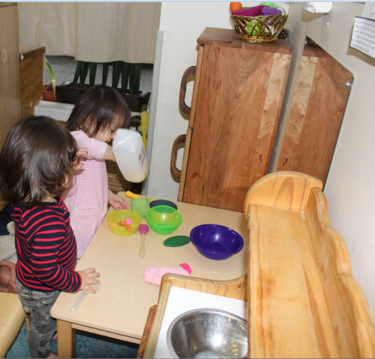 Friday, January 13, 2018- Rheya and Edith playing in the kitchen center.PNG