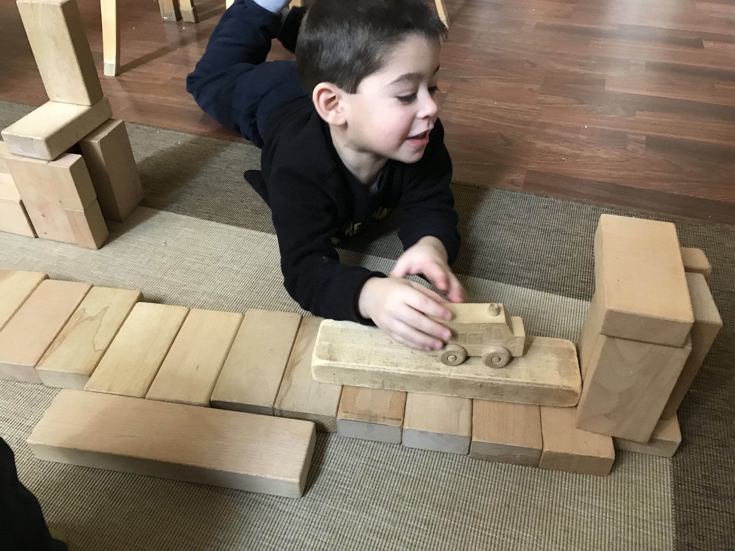 Dylan remembered that at the last workshop he made an airport.  This time he made another airport, but with a pathway for cars to enter.
