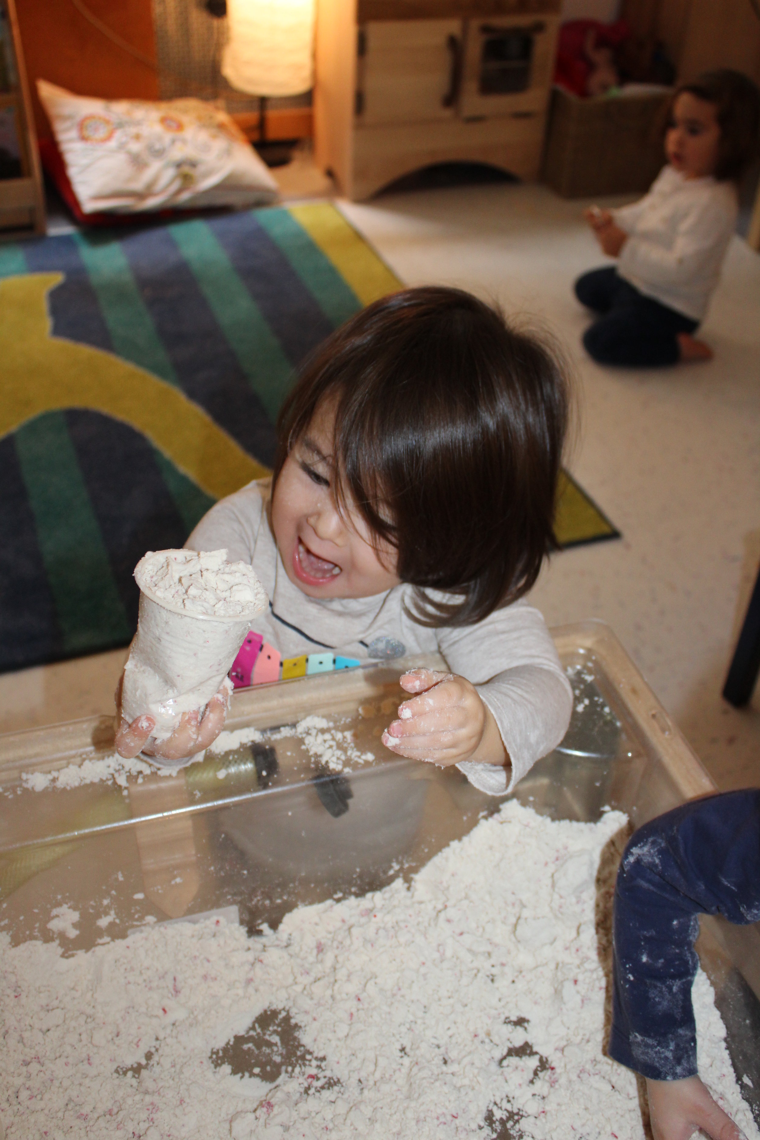  The children are familiar with this sensory activity, Cloud Dough!&nbsp; The consistency of the dough is interesting to feel and hold.&nbsp;It can be powdery like flour one moment,&nbsp;and moldable (like damp sand) the next.&nbsp; &nbsp;Rheya, Edie