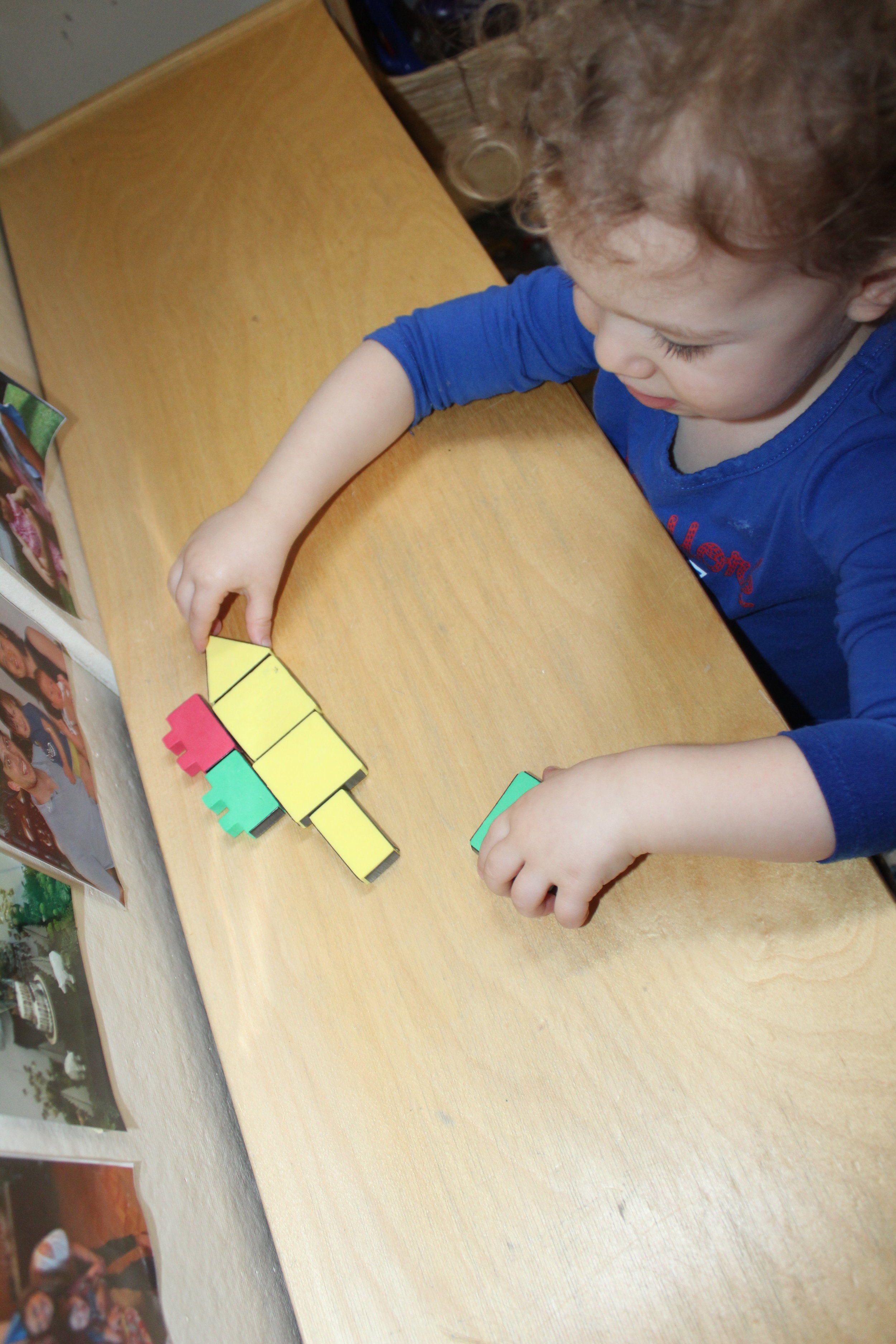  As Remy connects the shape, she said "Square shapes!! A house!" 