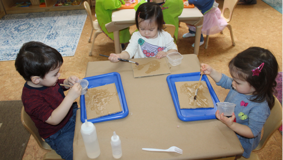   This is a 3 step project they first applied or poured the glue on the cardboard piece, and spread the glue using a paintbrush.&nbsp;&nbsp;Using brown and white crinkle cut shredded paper, the children placed them in different areas on the cardboard