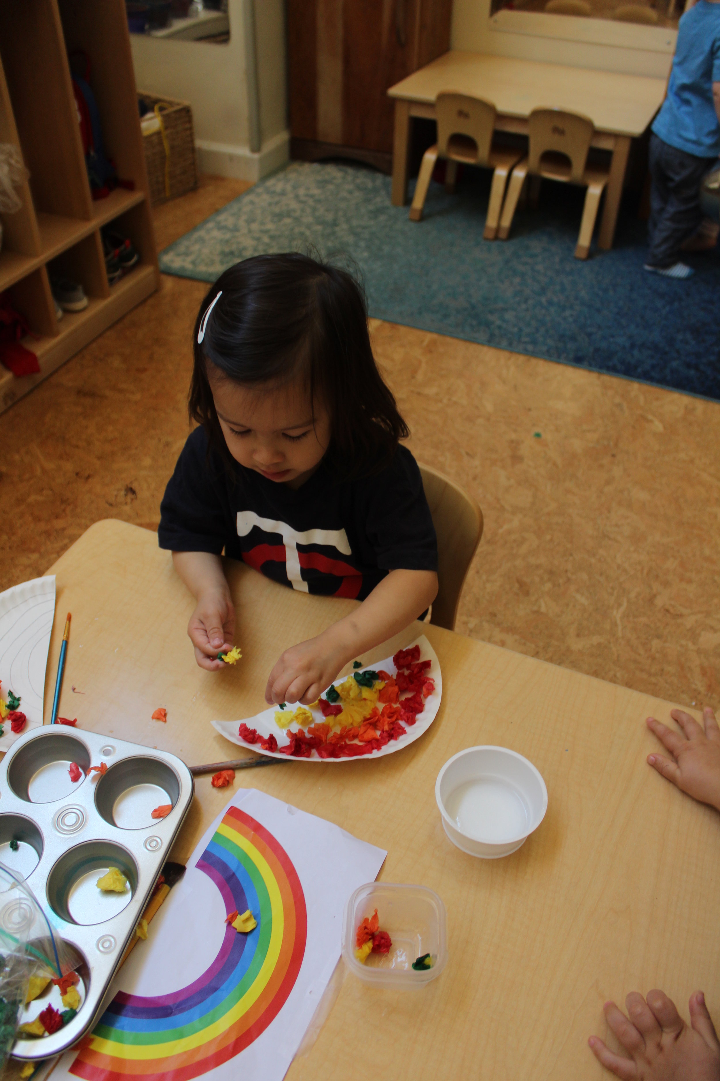  Creating a rainbow using paper plates and tissue paper! 