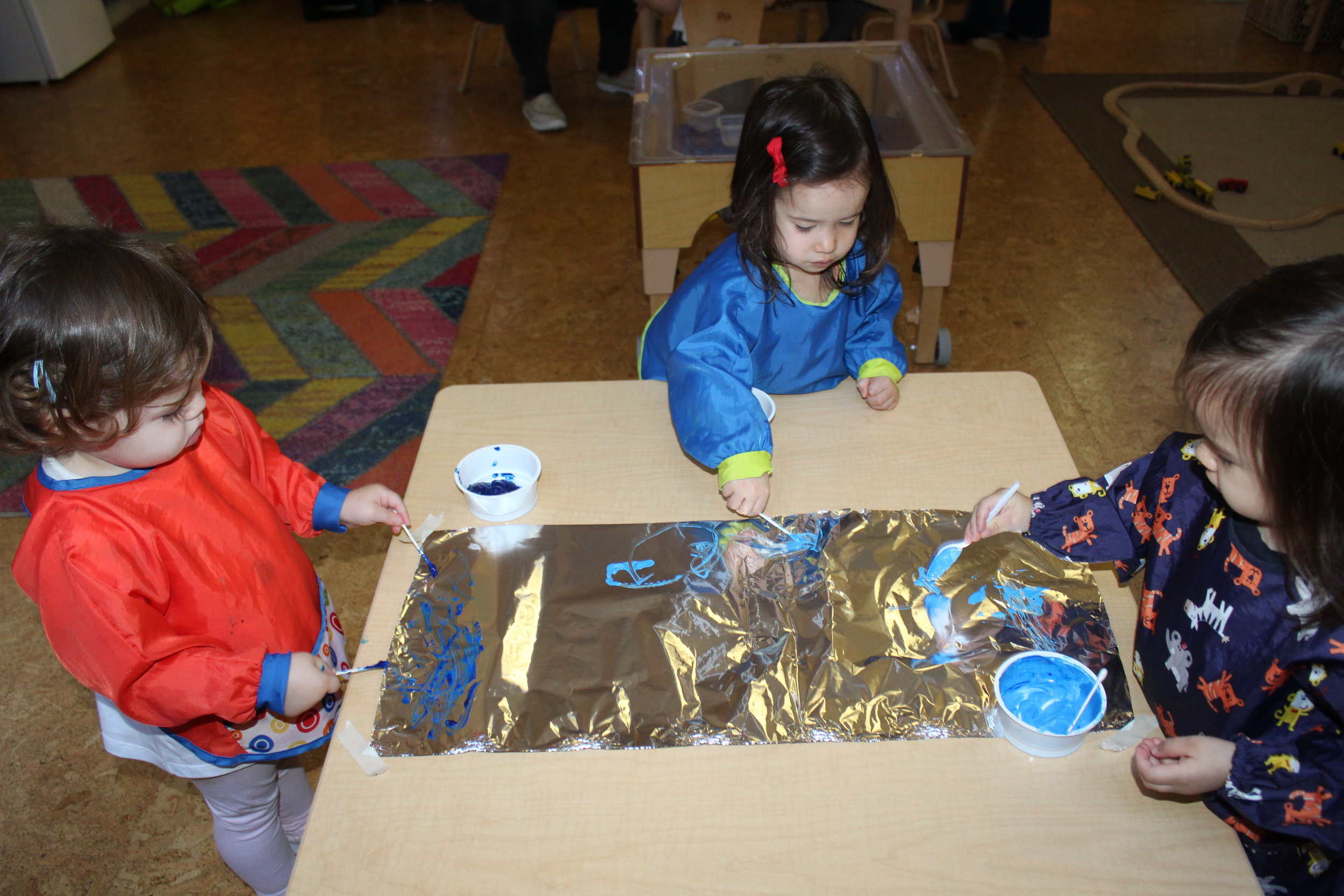  Using tin foil and paint, the children delve into exploring using their hands and fingers. In process art there is no step-by-step instruction, there is no right or wrong way to explore and create. The art is focused on the experience, and on the ex