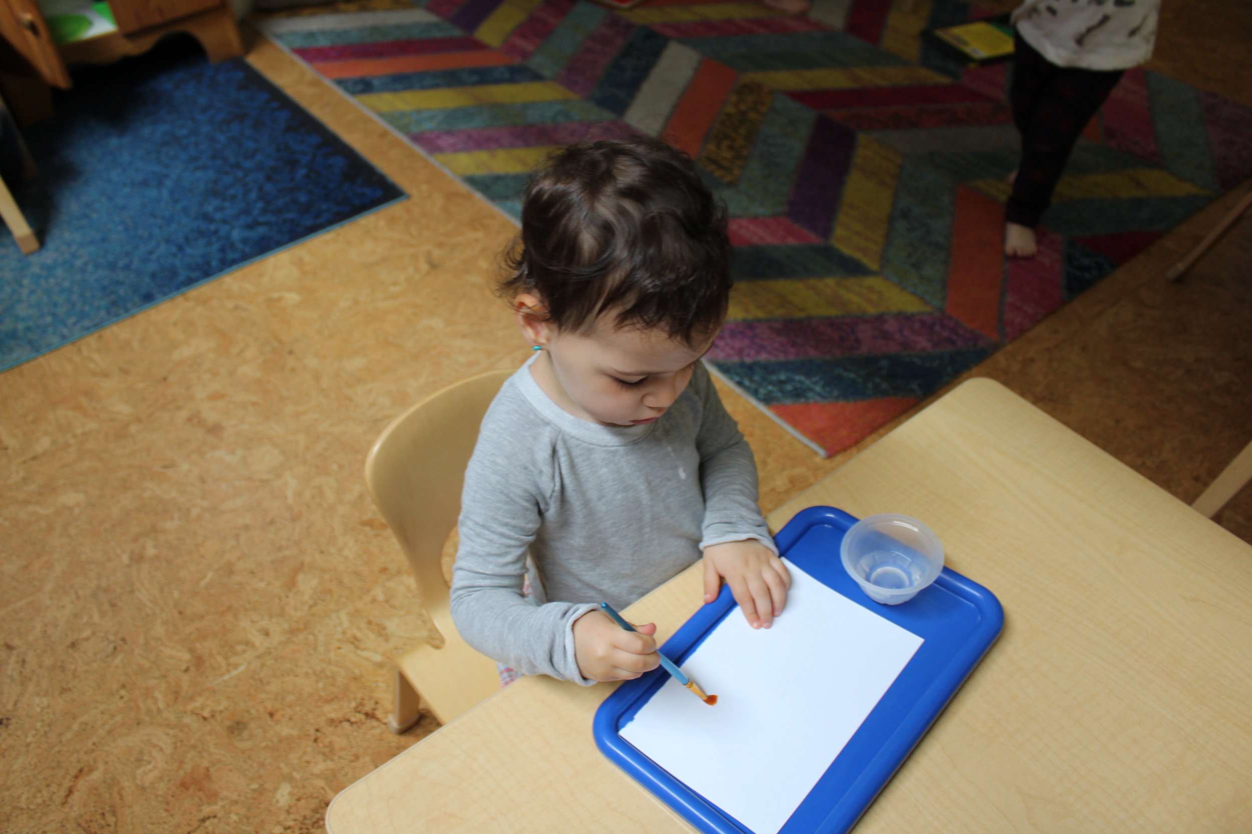     A collage is an artwork made up of different papers or objects glued together. The two-step process art, applying glue and pasting the tissue paper seemed to intrigue the children. Exploring and experimenting with the arrangement of shapes on pap