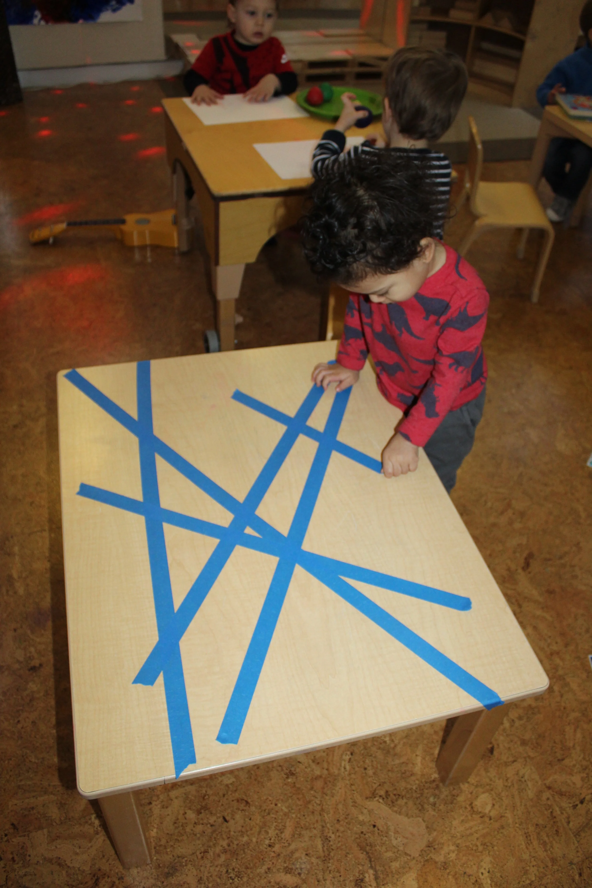 Fine motor activity using tape!  The children can peel it off and stick it back down.&nbsp; Great for building hand strength!   
