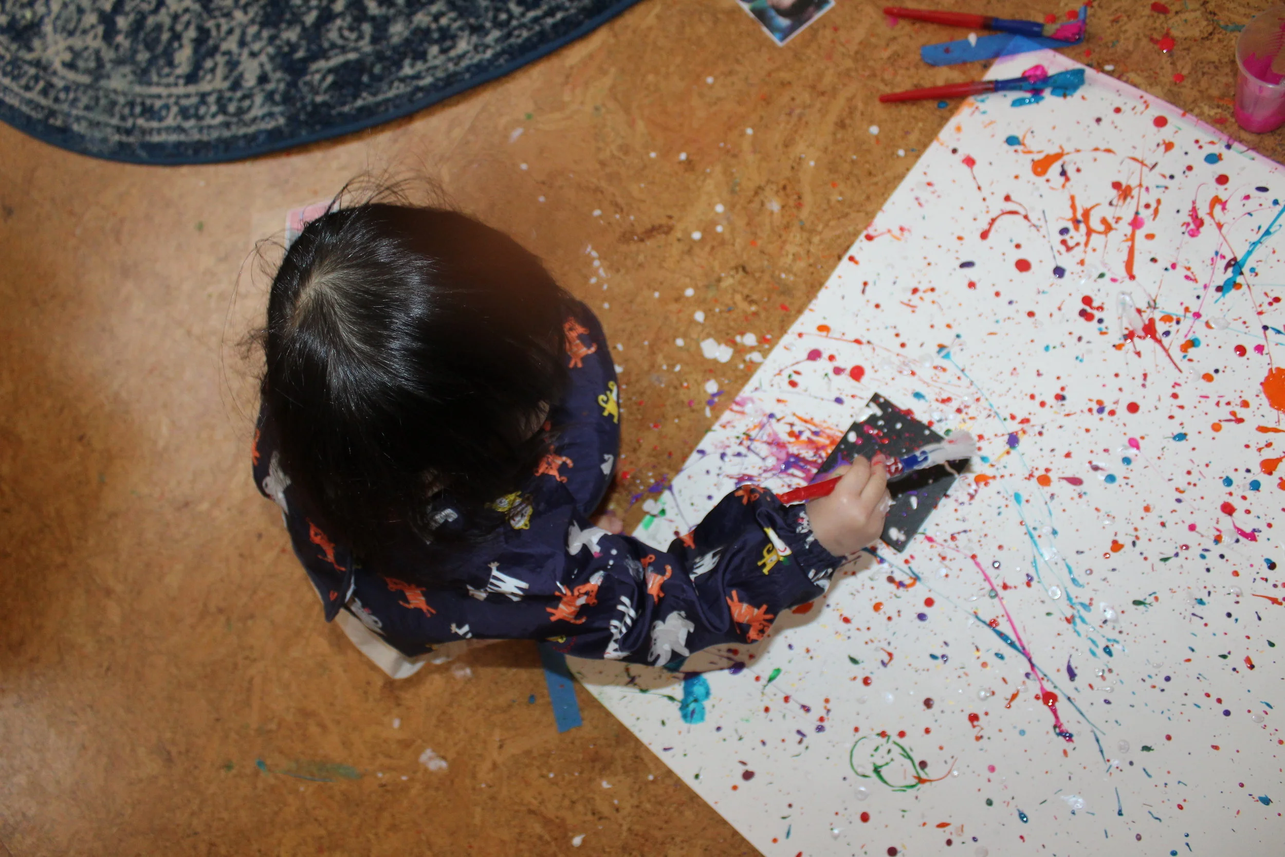  The children created a splatter painting design on a square black canvas, and the poster board that was protecting the floor from getting painted is our beautiful unintentional art! We will incorporate Jackson Pollock, a well-known artist for his sp