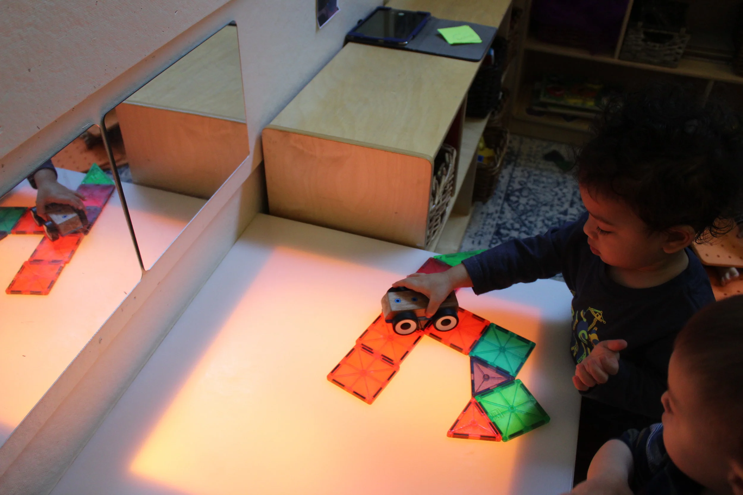  Children are becoming more imaginative and creative as they interact with Magna-tiles and blocks ( bristle, Lego, and unit). Their expressive and receptive language are increasing as they develop. 
