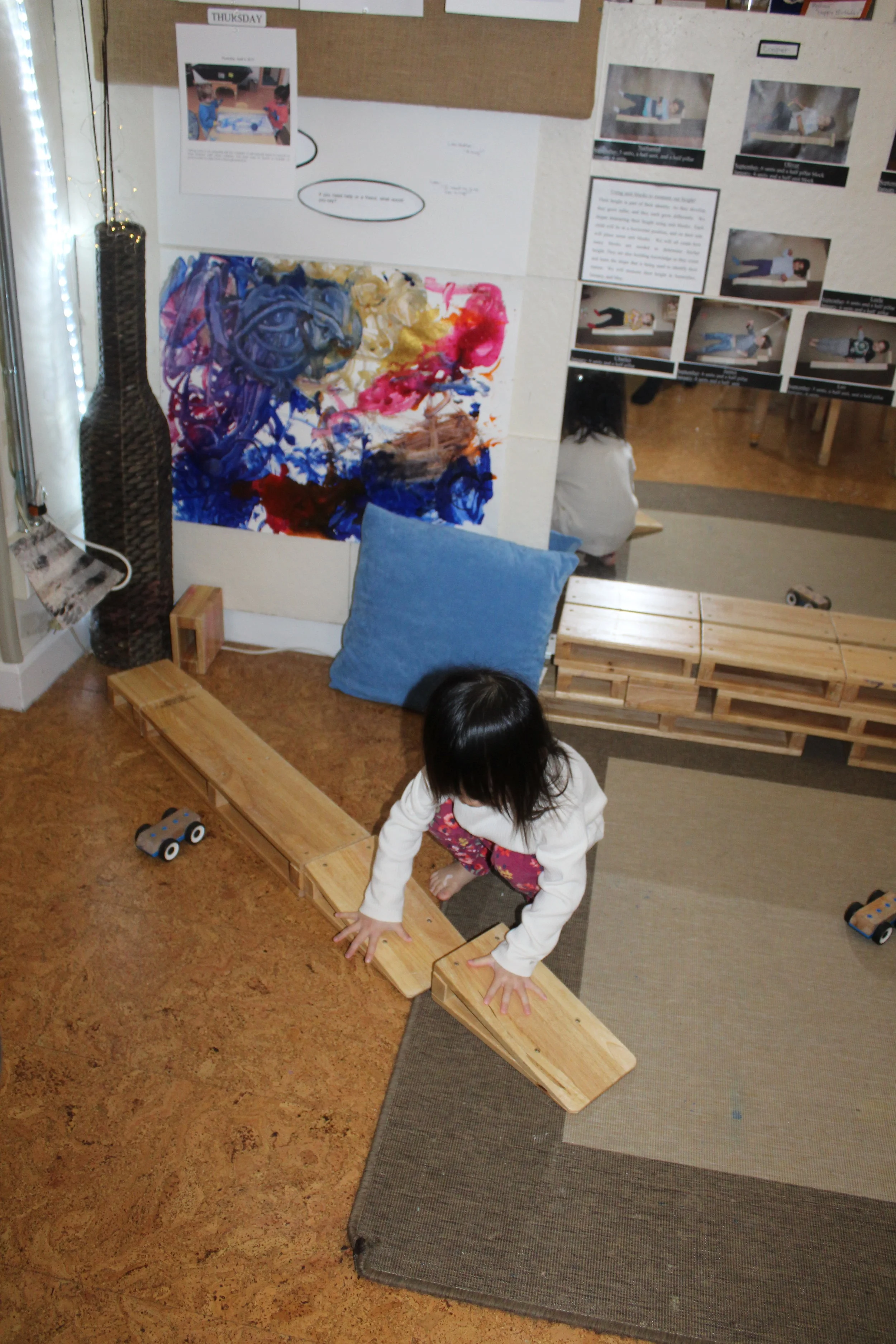  Nicole, out of her own accord made a replica of the block structure that was created last week. She is curious and developing interest. 
