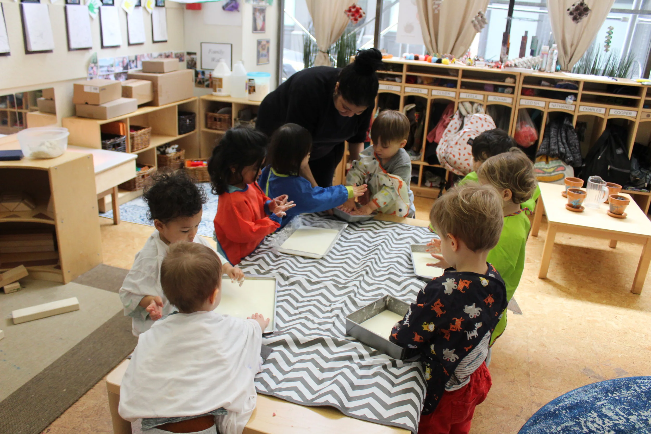  Sensory Day!  They are exploring sand, flour, and cornstarch in water. As the children investigated, they are also learning about texture and color.&nbsp;   