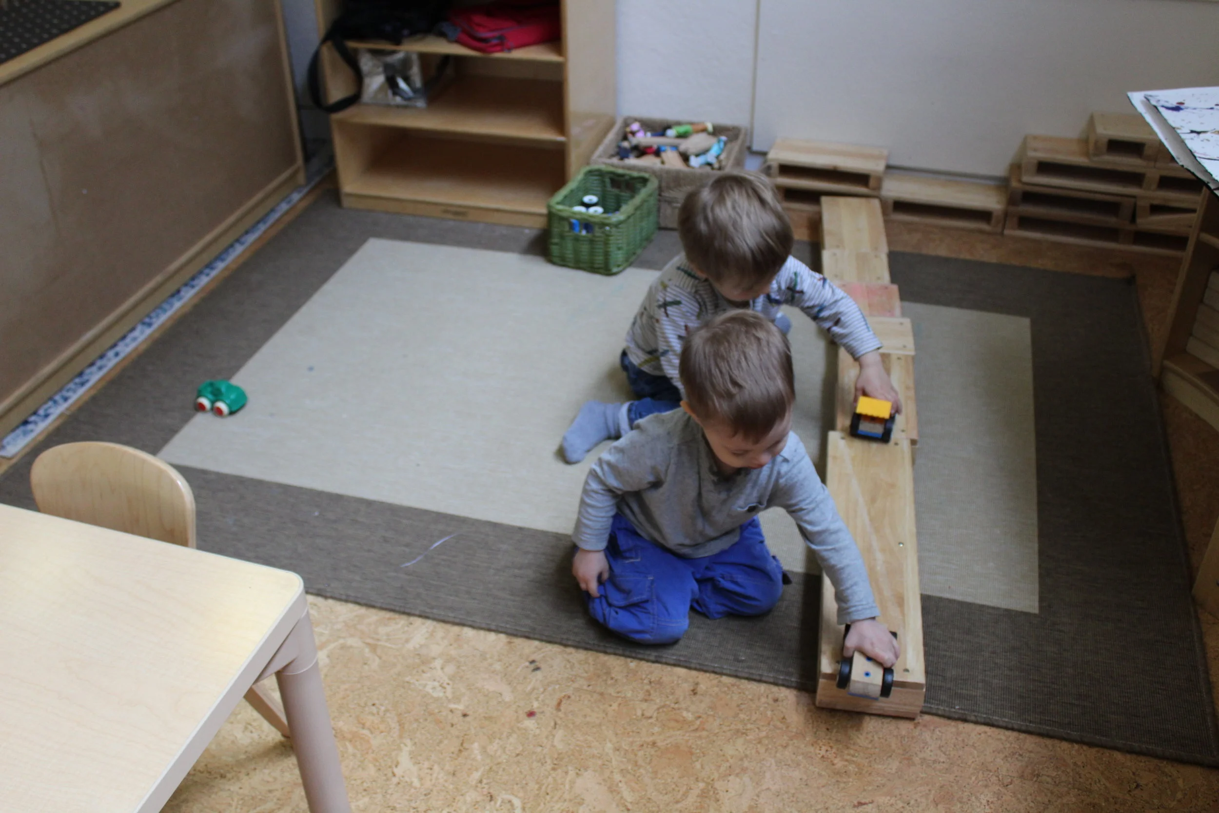  Nathaniel and Leo joined Leo Shaftel at the Block Center. Leo Shaftel articulated, "I made a road!" The all shared the space as they used the cars. 