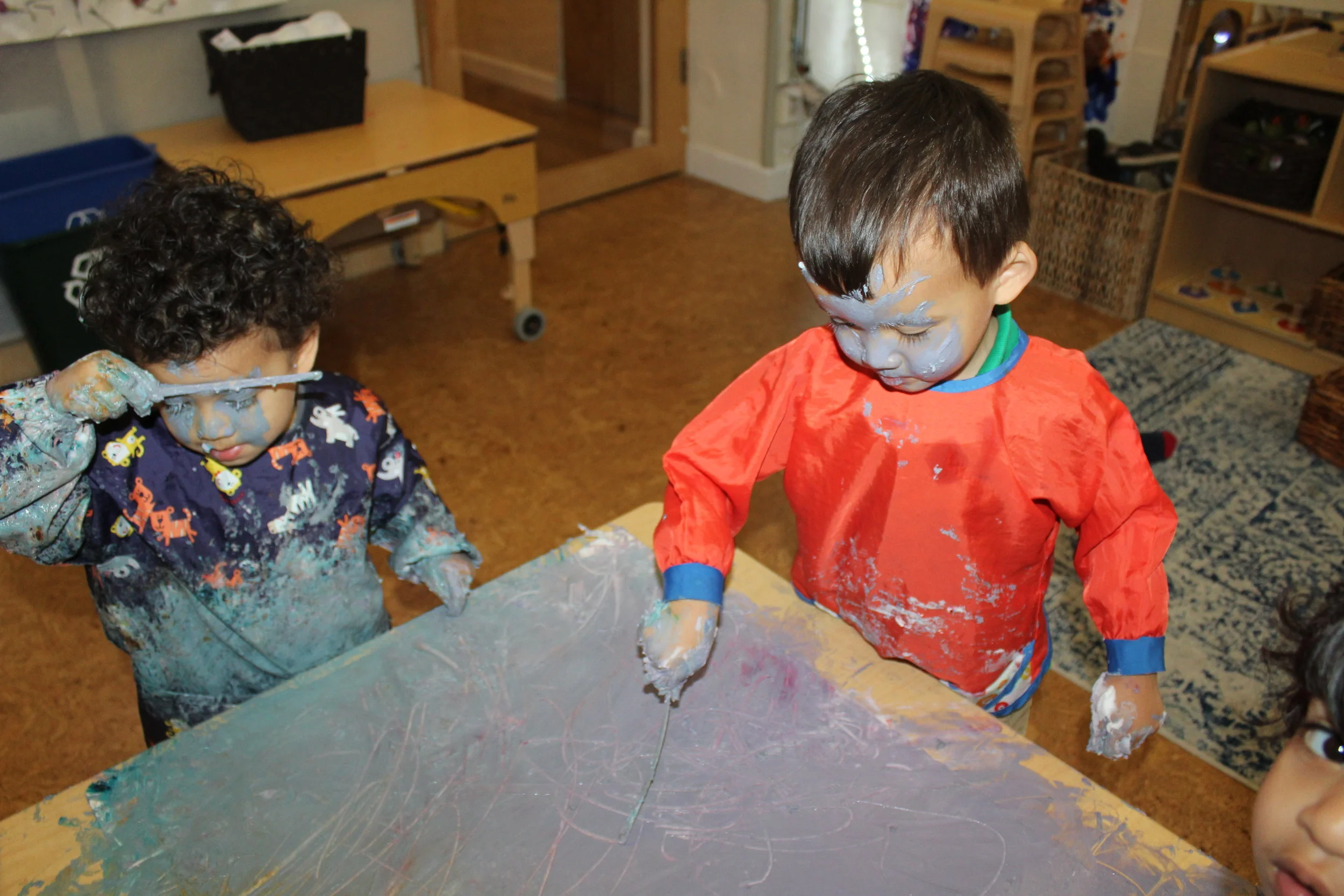  Some of the children decided to continue exploring by applying paint on their faces!! 