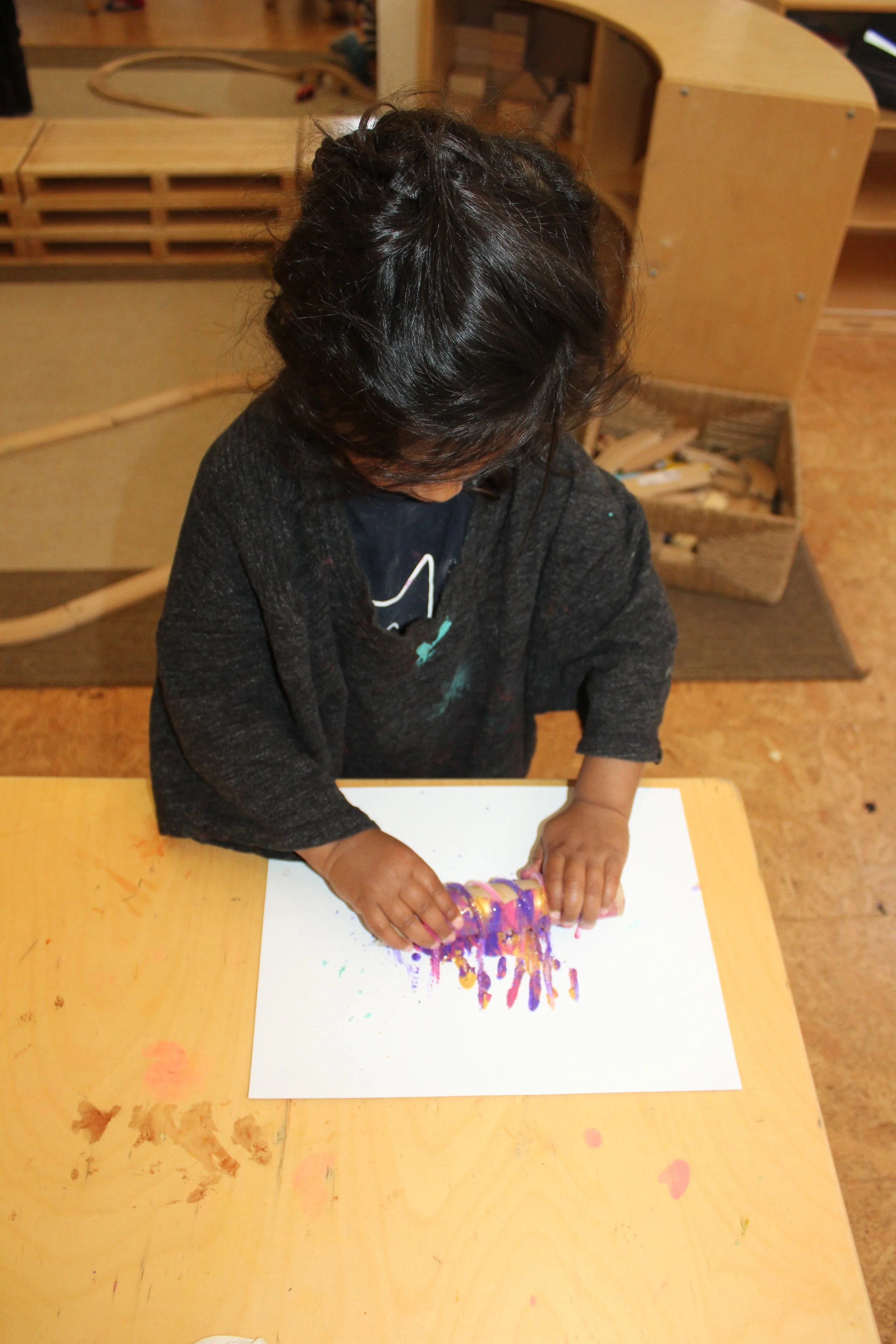  Pipe cleaners glued on recycled paper rolls, made an interesting art tool.&nbsp; The children selected three colors and rolled back and forth the roller, creating straight and wavy lines.&nbsp;&nbsp;   