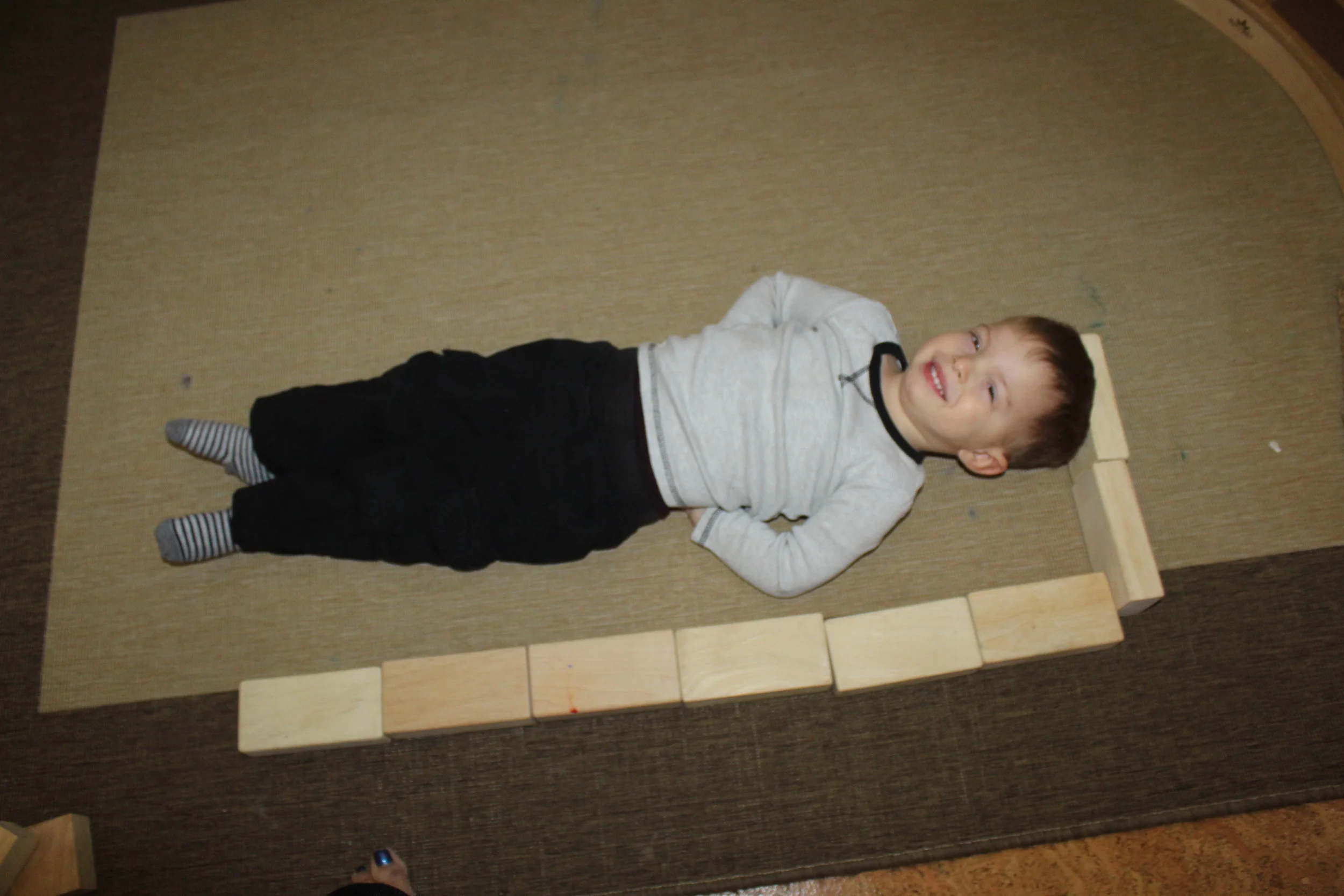  We are almost done measuring all the children! The last time we measured them, was in January. On some children, we are adding a half pillar or unit block. The activity promoted math (counting and geometric shapes) and encouraged them to interact wi